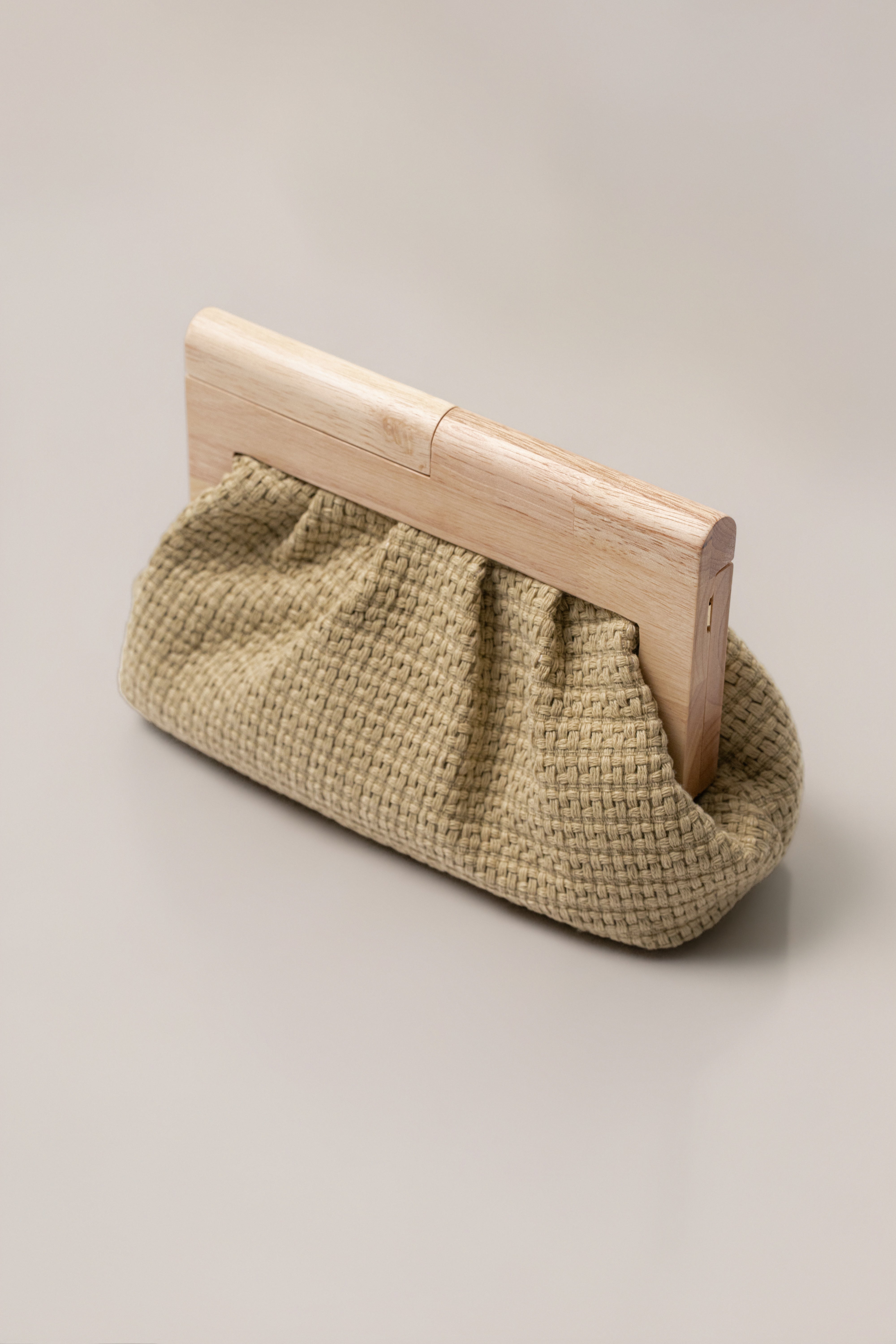 Natural Mykonos clutch bag by JLUXLABEL, stylish accessories with woven design and compact size for elegant carry.