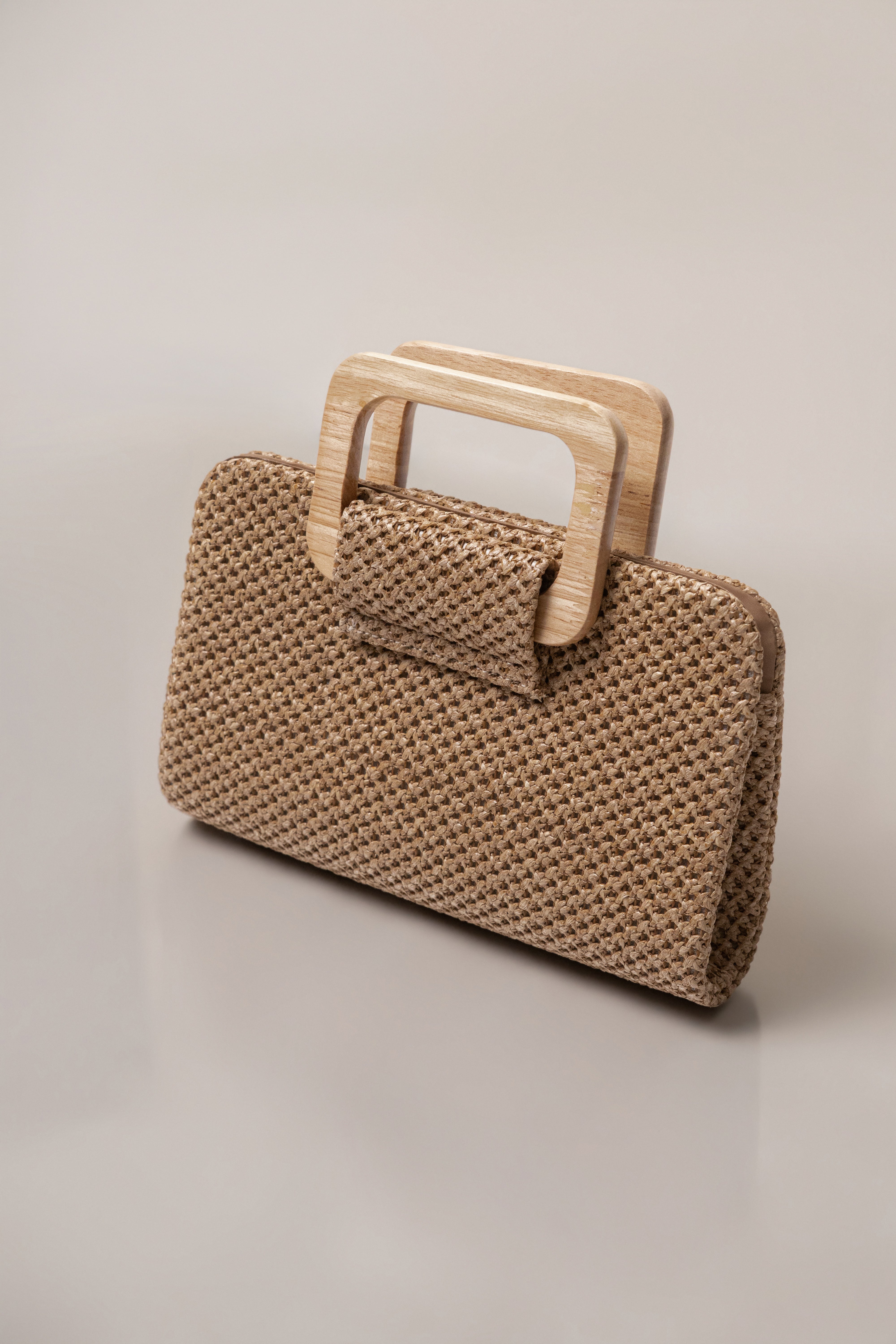 Brown driftwood clutch bag from JLUXLABEL, showcasing textured wooden design and compact accessory style.