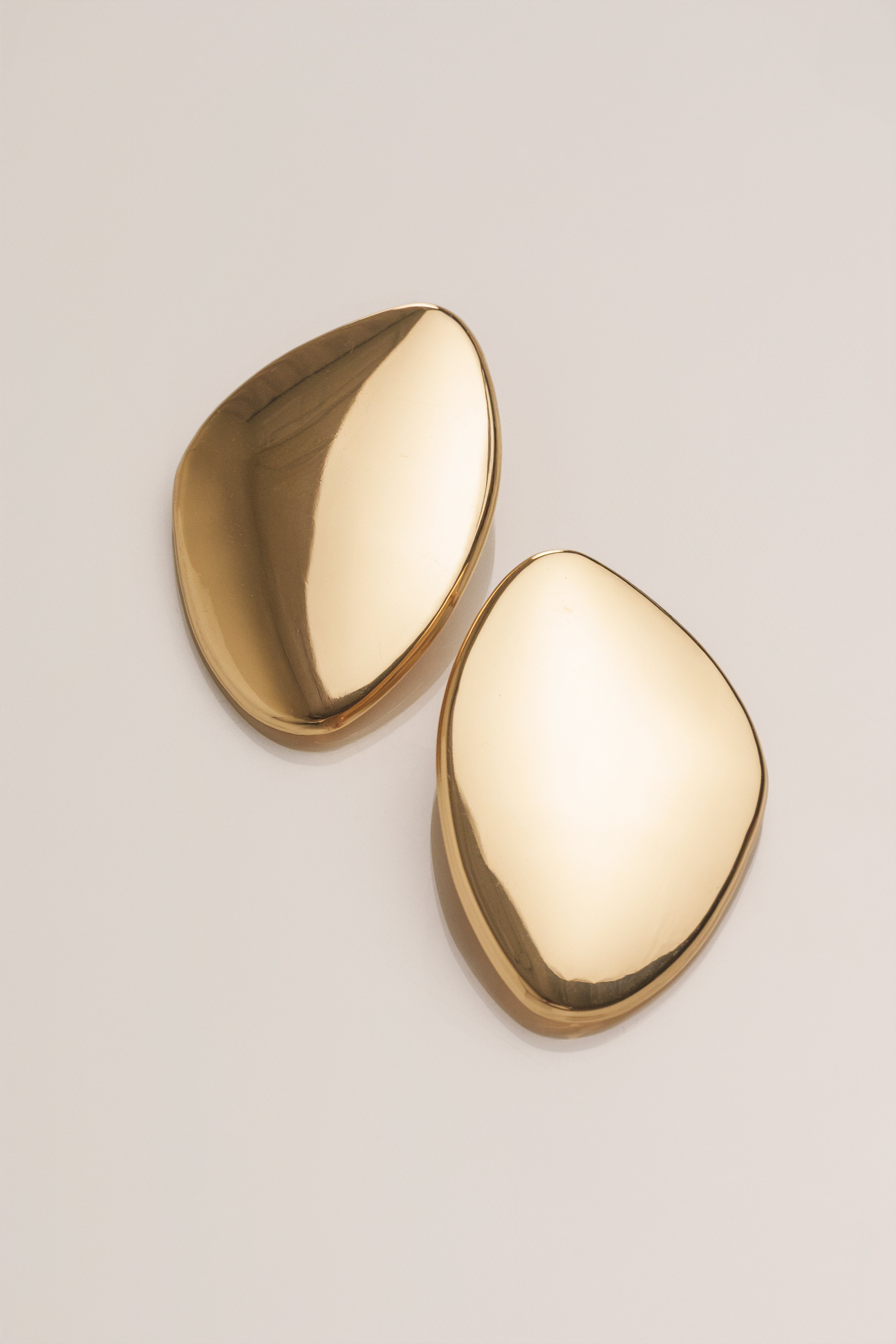 Gold Becca Oval Earrings jewelry by JLUXLABEL featuring sleek oval design and shiny gold finish.