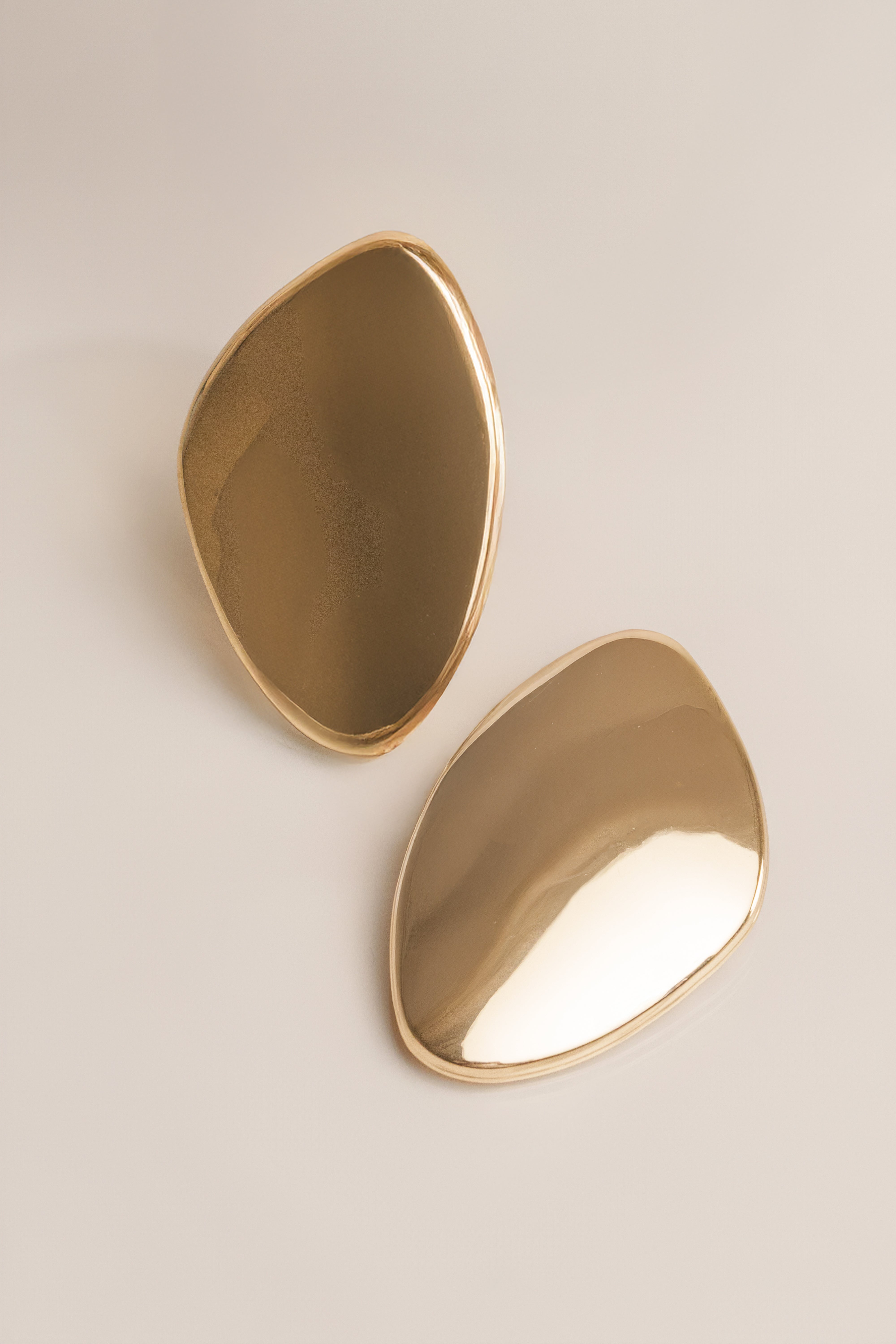 Gold Becca oval earrings from JLUXLABEL, showcasing elegant jewelry with a polished oval design and shiny gold finish.