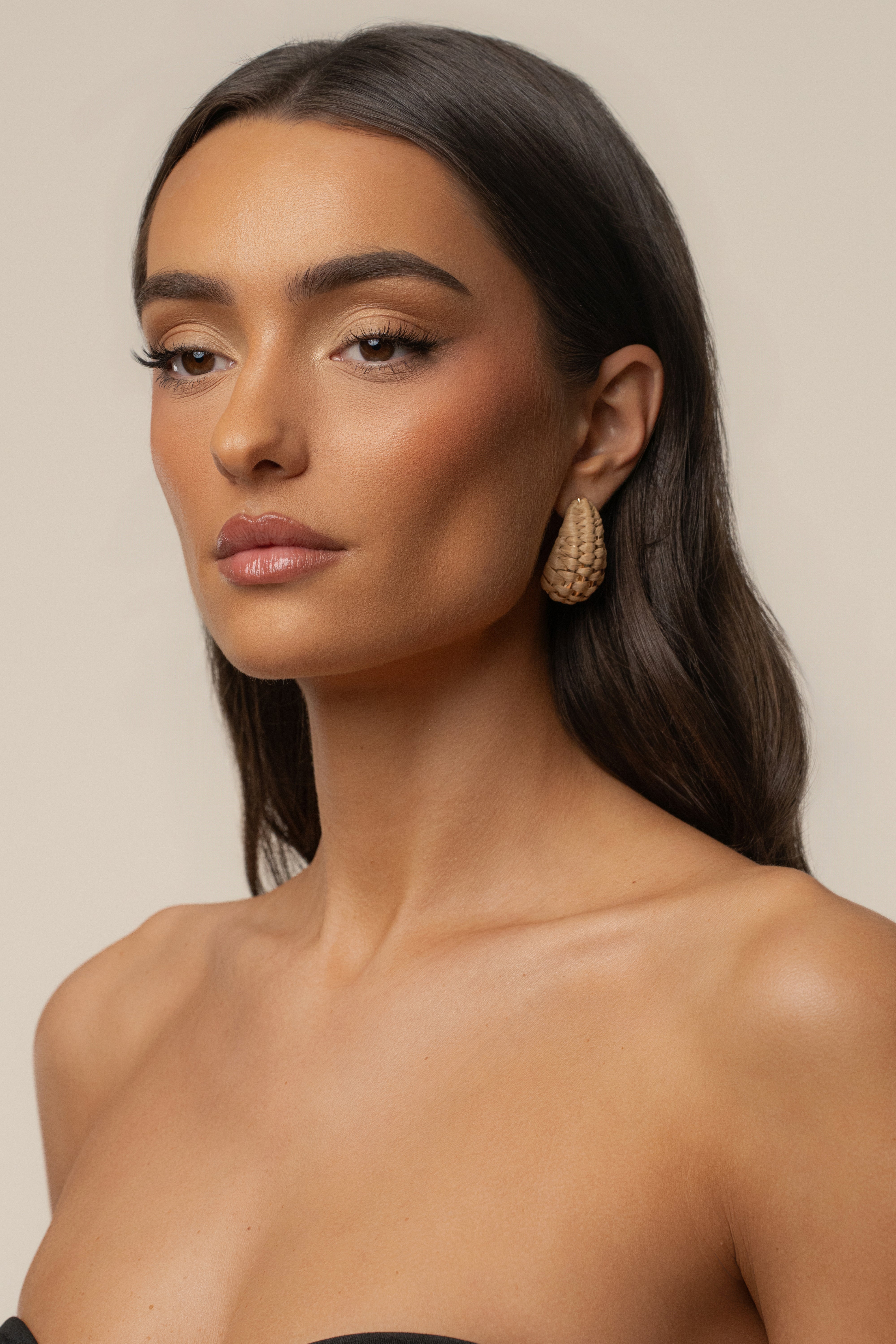 Natural Alana Raffia Earrings by JLUXLABEL featuring woven raffia design and gold-tone accents, styled as jewelry accessories.