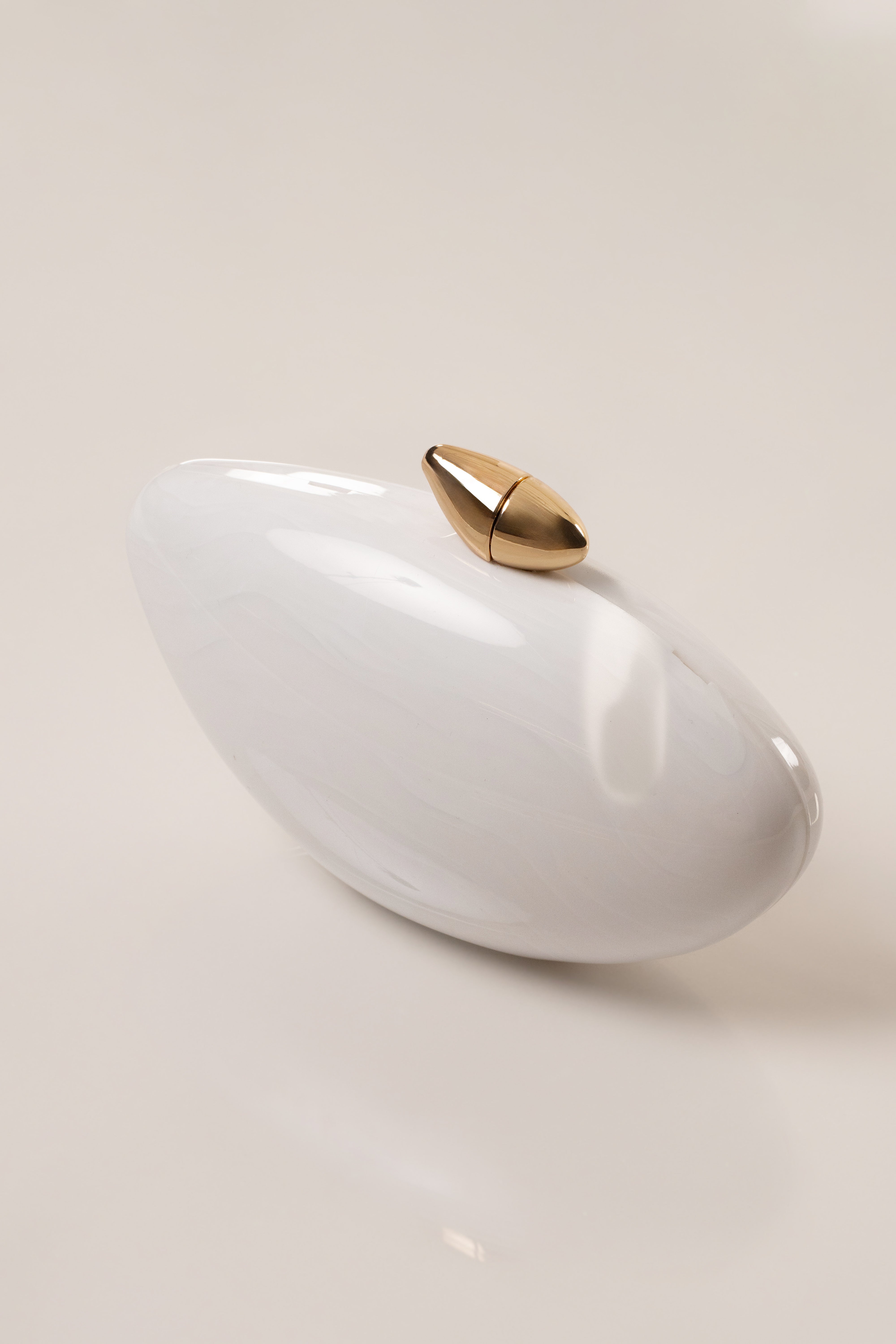 White Sea Muse Pearl Clutch accessory by JLUXLABEL with pearl detailing and elegant design.