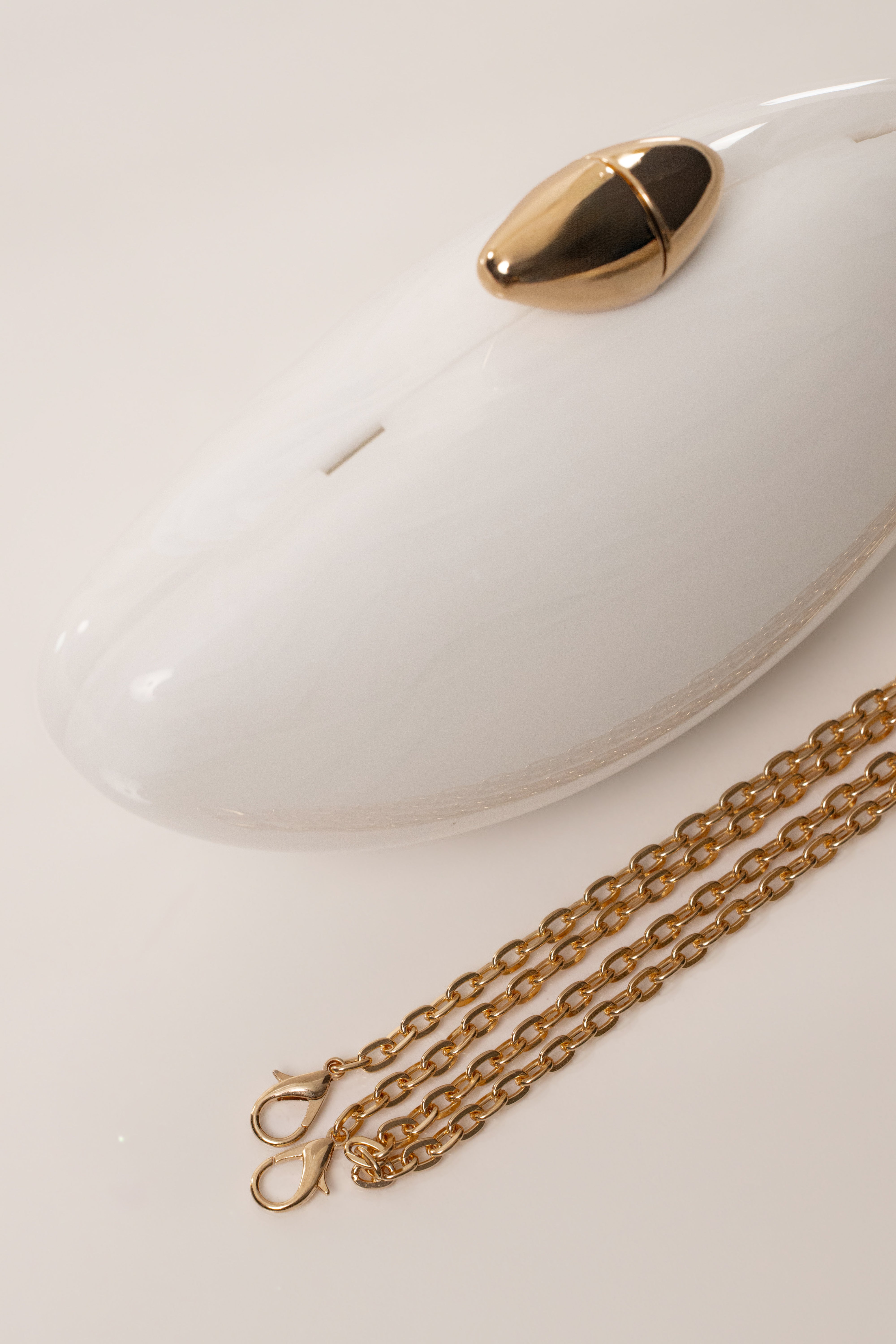 White Sea Muse Pearl Clutch accessory by JLUXLABEL with pearl embellishments, stylish and elegant for evening occasions.