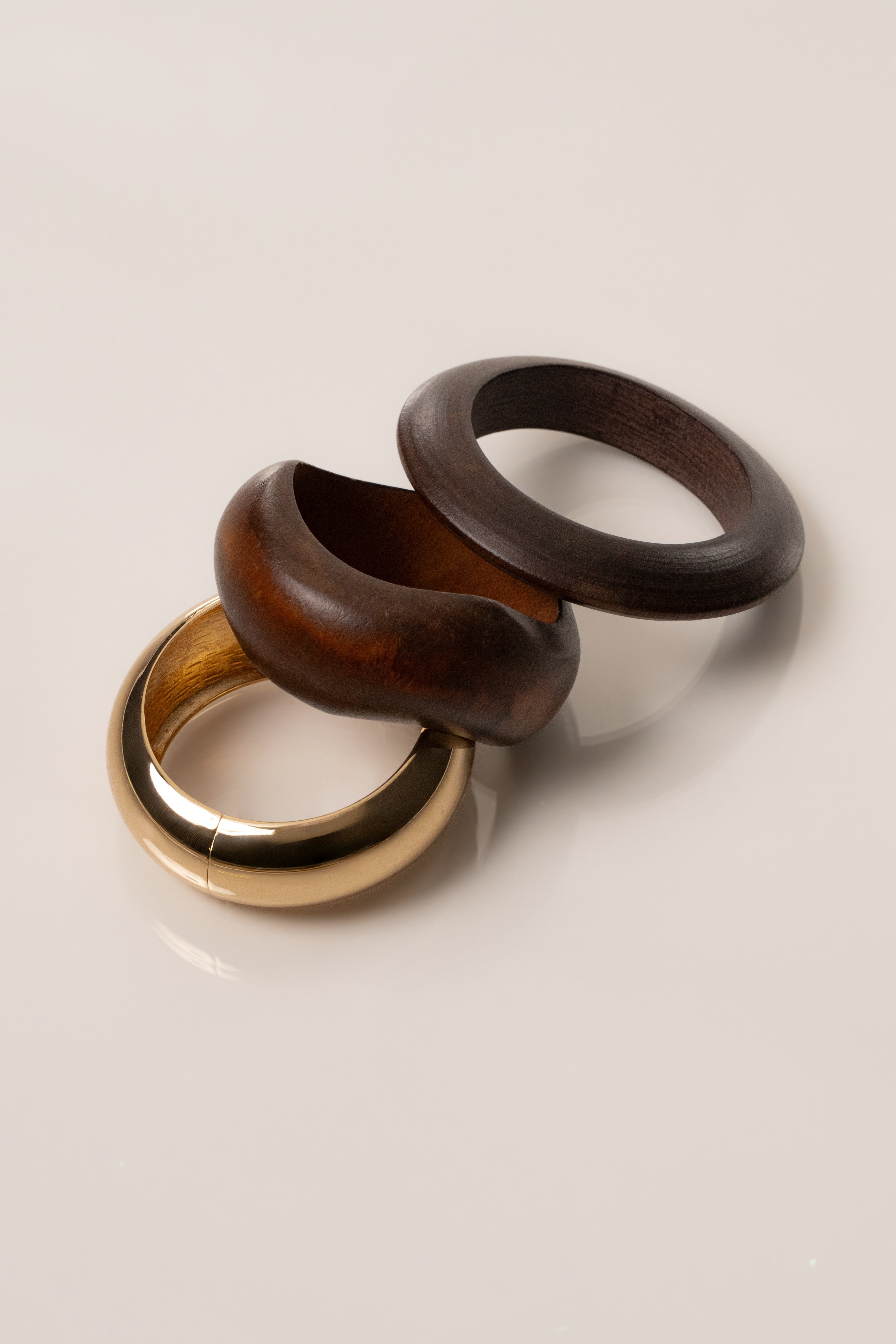 Gold Kora bracelet set from JLUXLABEL featuring multiple layered gold jewelry pieces on a neutral background.