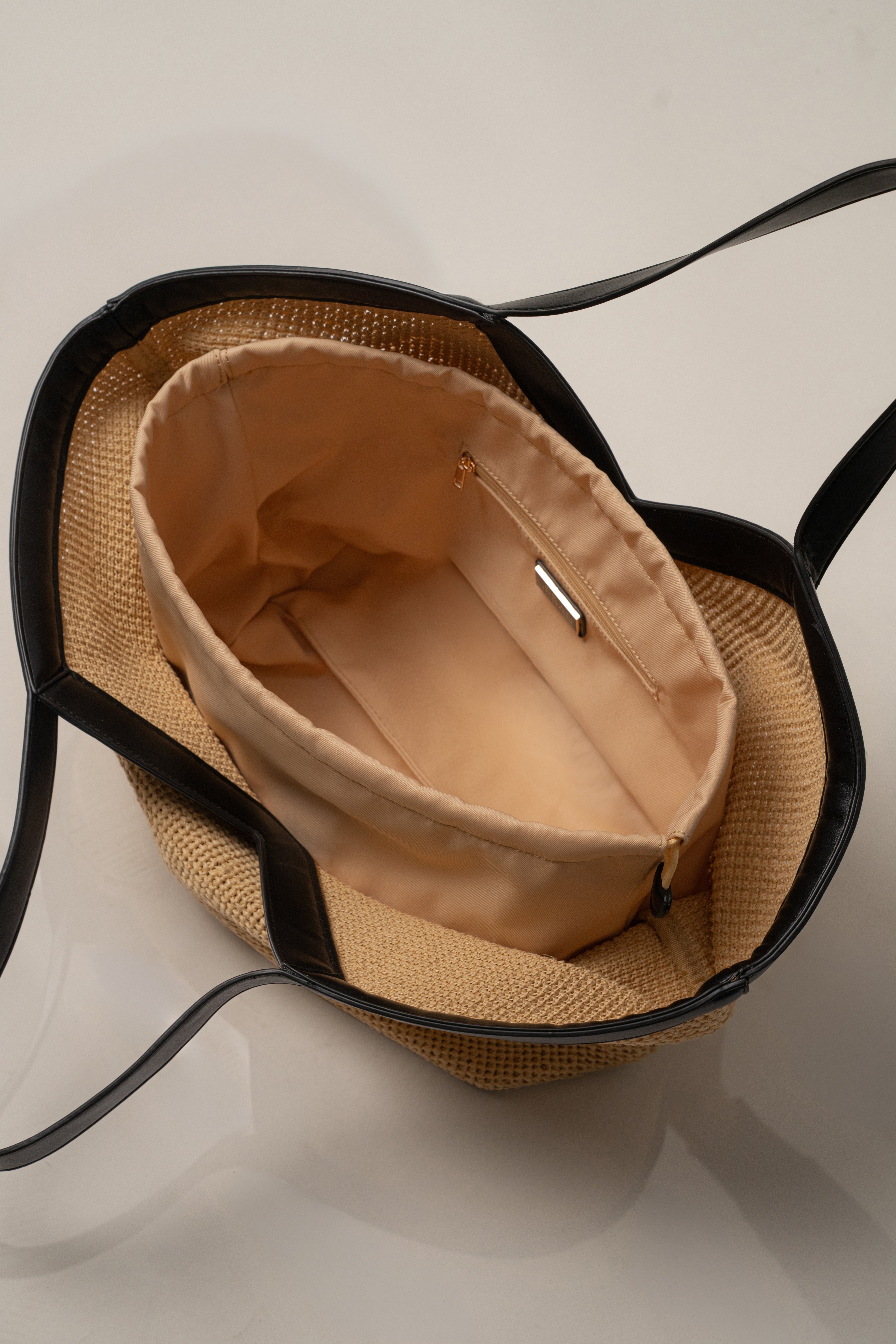 Natural The Coastal Resort Bag by JLUXLABEL, a stylish woven accessory with leather accents and top handles, perfect for summer outings.