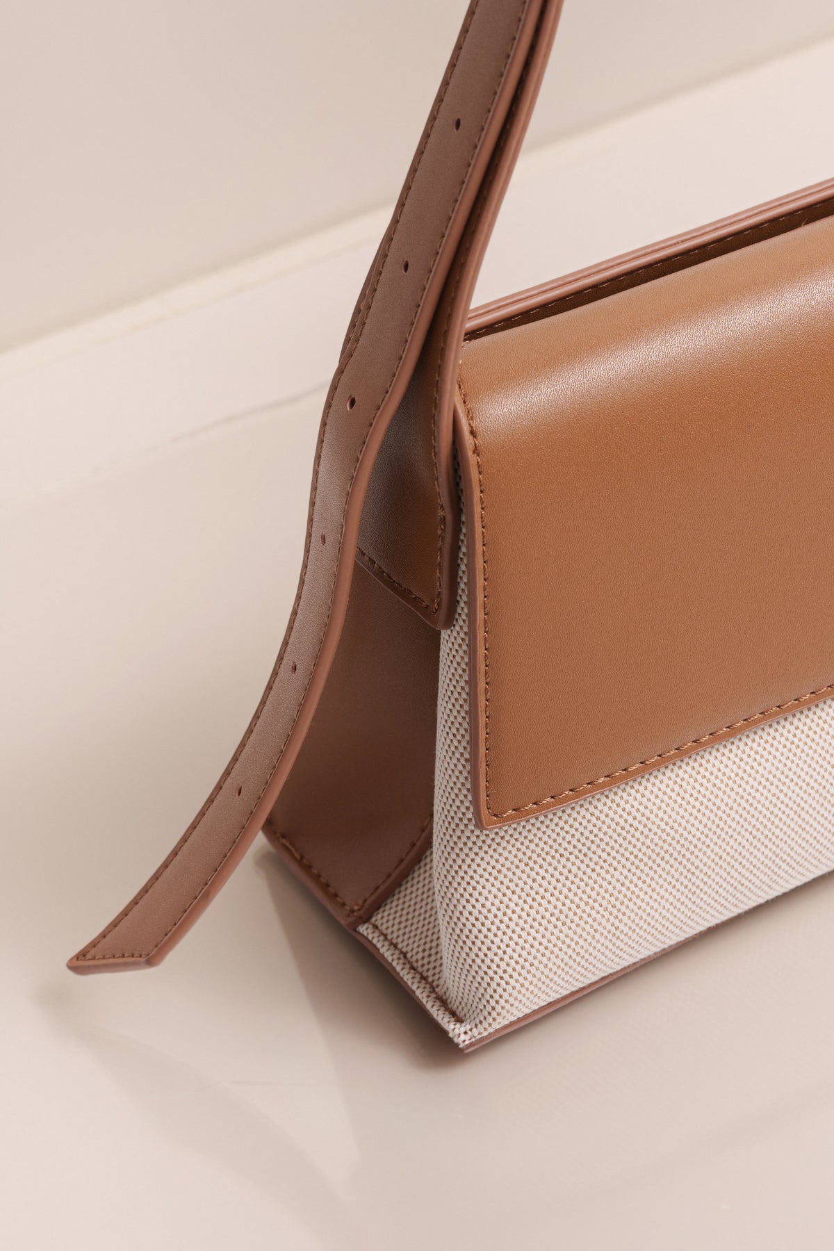 Beige JLUXLABEL Hudson shoulder bag with shoulder strap, stylish accessories for casual or formal outfits.