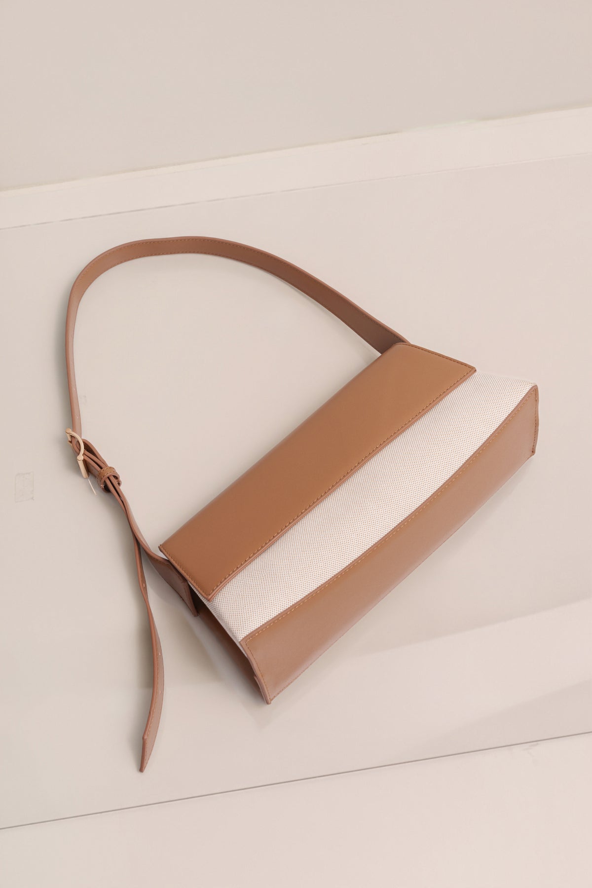 Beige JLUXLABEL Hudson shoulder bag with adjustable strap, stylish accessories for casual or chic outfits.