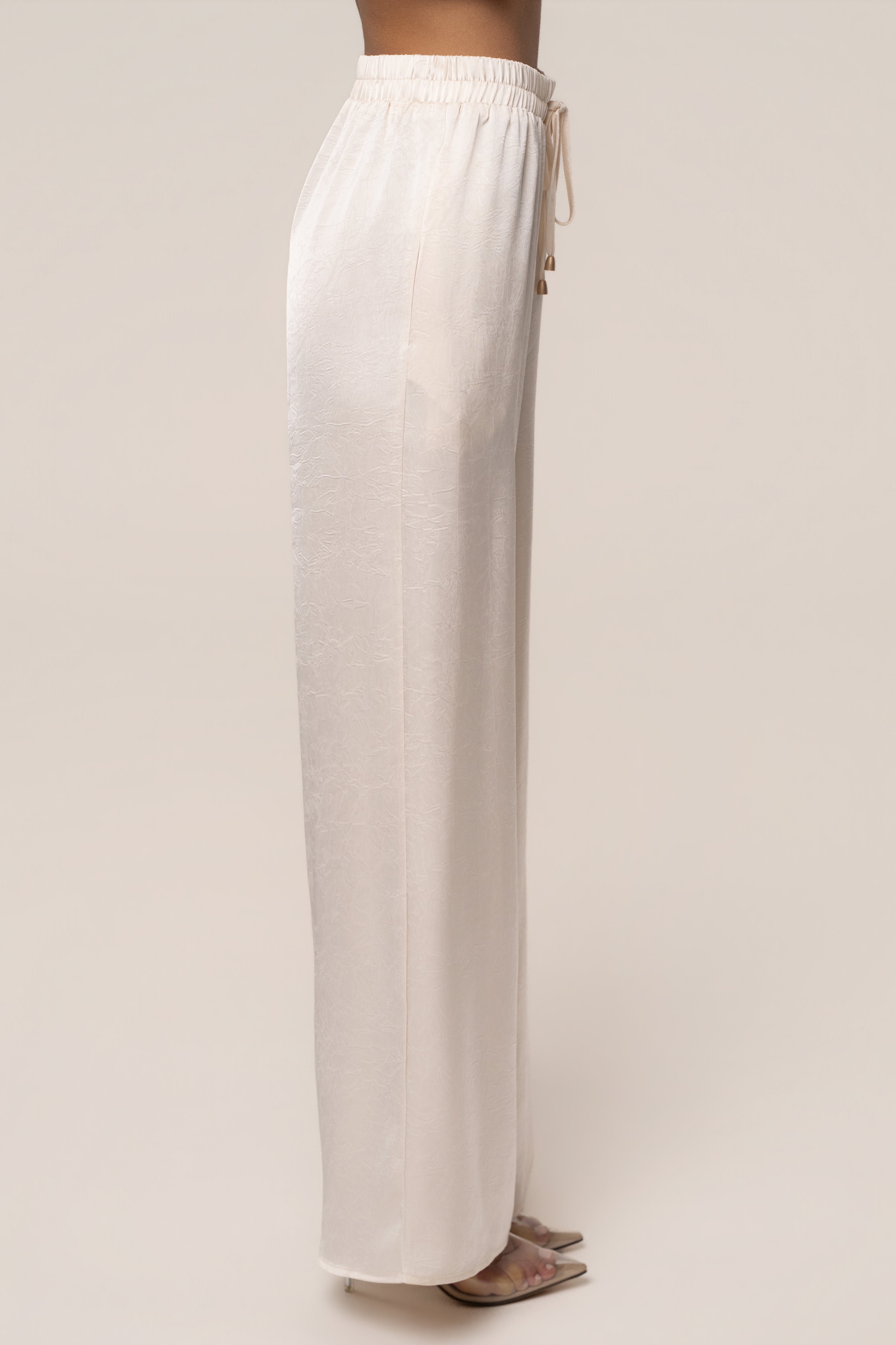 Cream satin pant set with draped design from JLUXLABEL, featuring a stylish, elegant look perfect for chic fashion occasions.