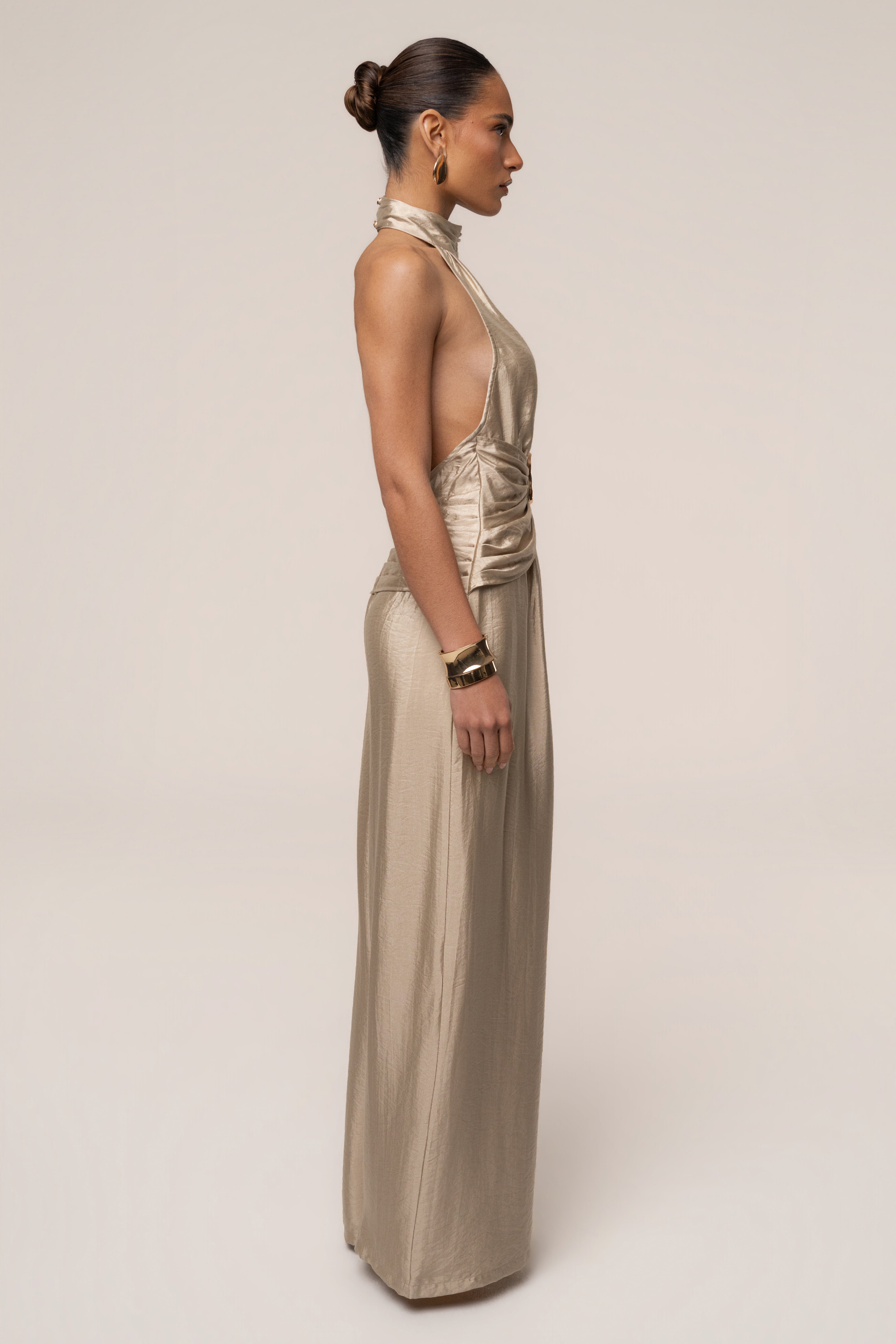 Gold accent jumpsuit by JLUXLABEL featuring a stylish design, perfect for fashion-forward occasions.