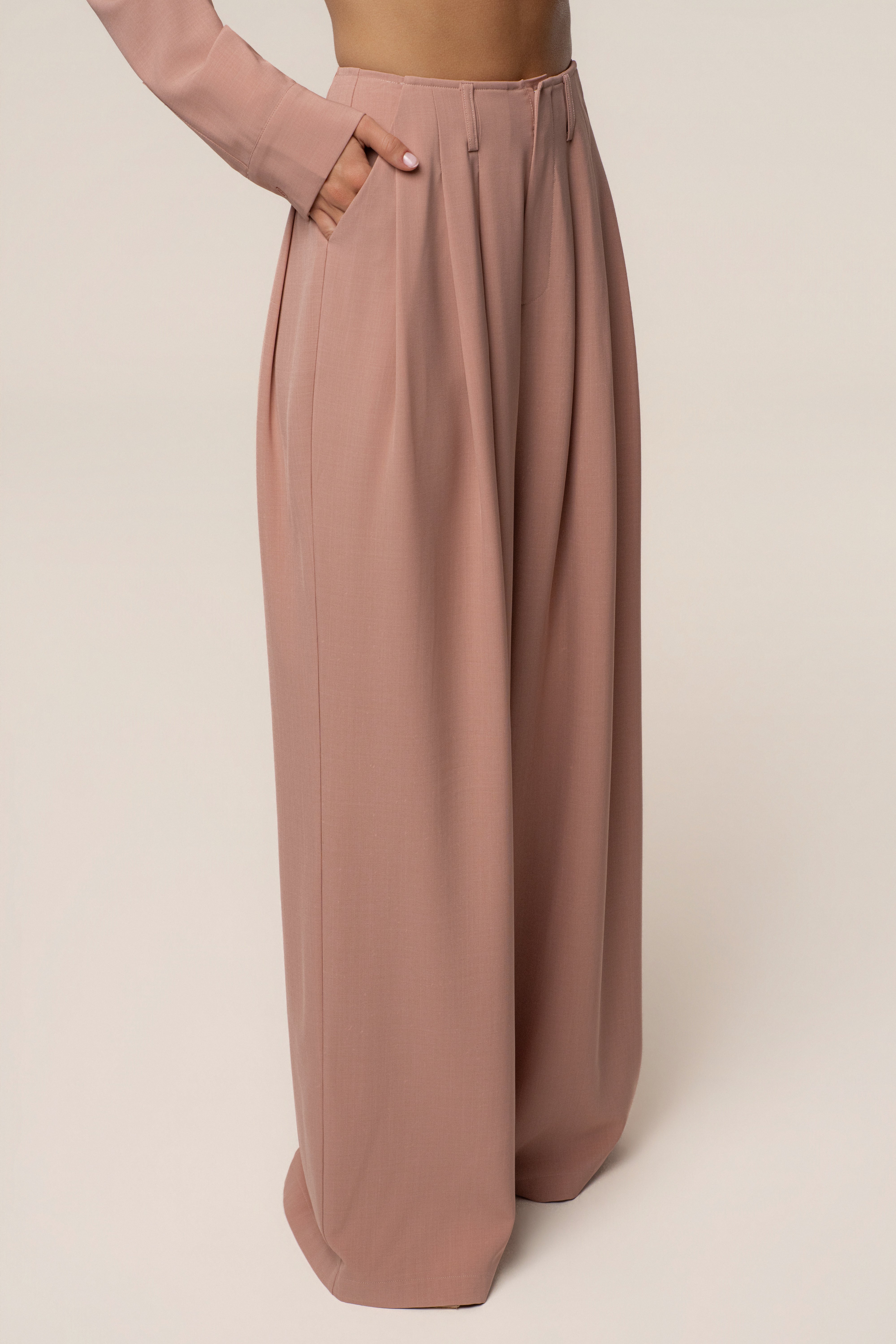 Mauve JLUXLABEL pleated bottoms with a tailored fit, featuring a high waist and wide-leg design, styled on a model.