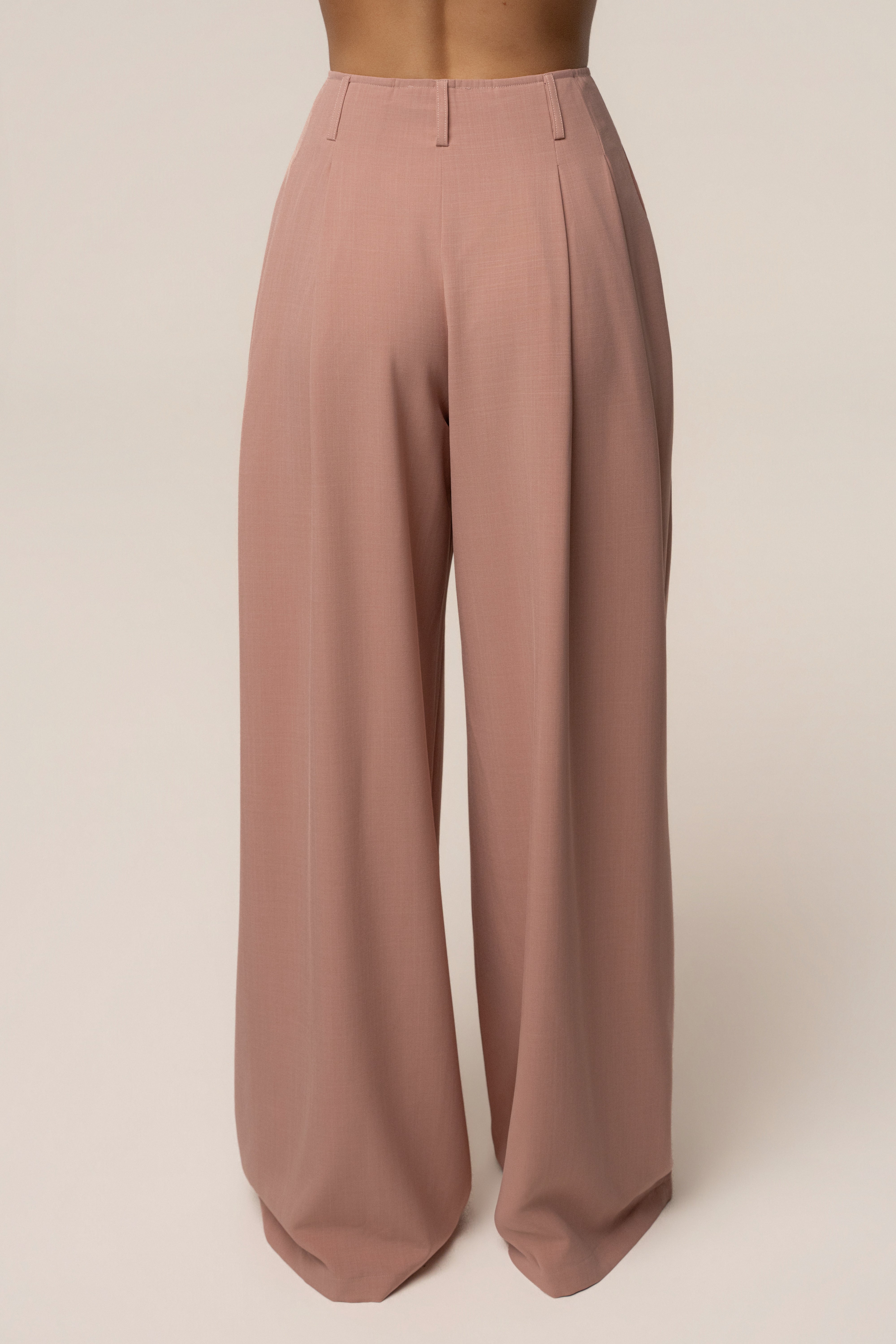 Mauve JLUXLABEL pleated trouser with a relaxed fit and high waist, shown in a stylish image highlighting the fabric and design details.