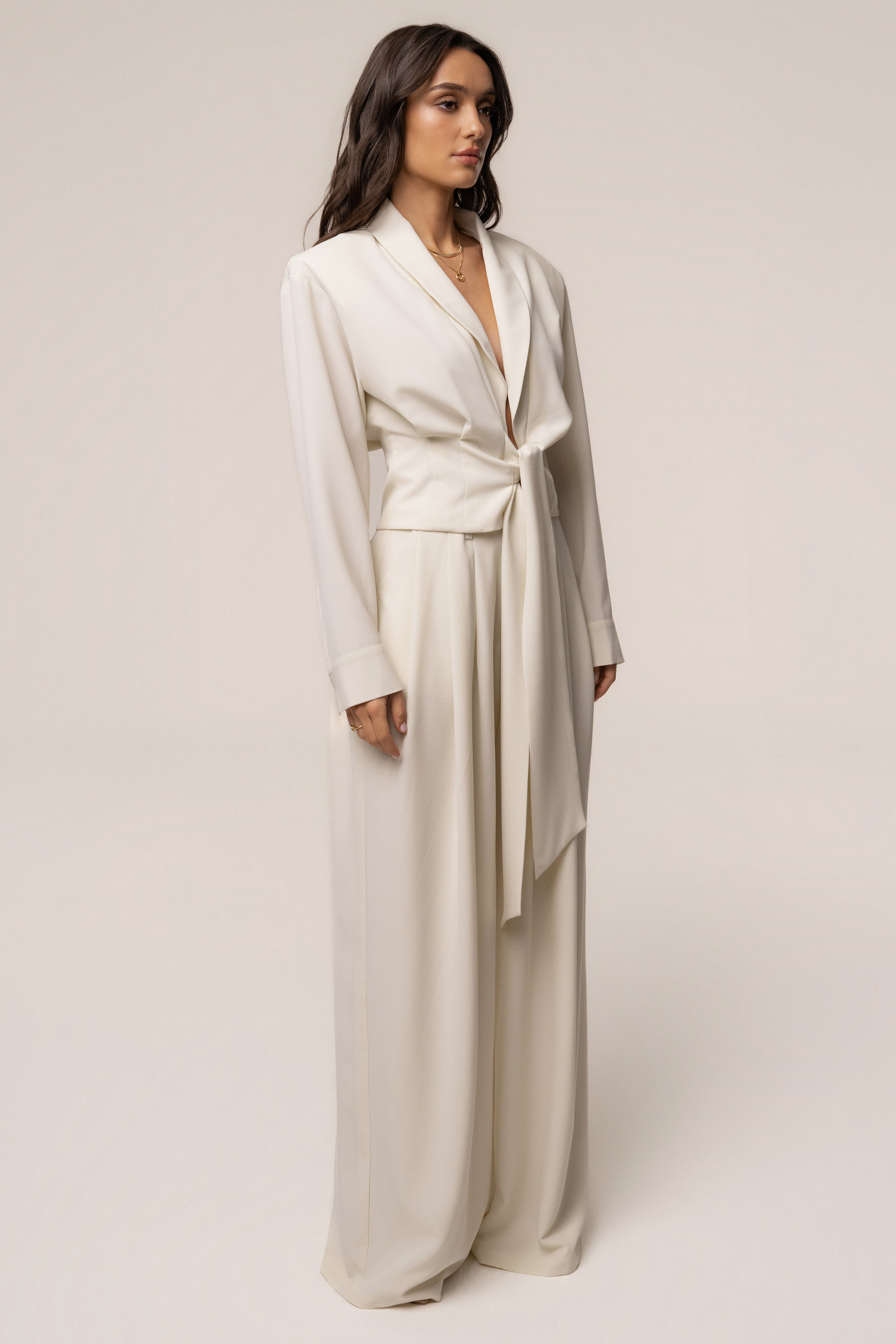 Cream JLUXLABEL pleated trouser shown from the front, featuring a high waist and tailored pleats for a stylish, sophisticated look.