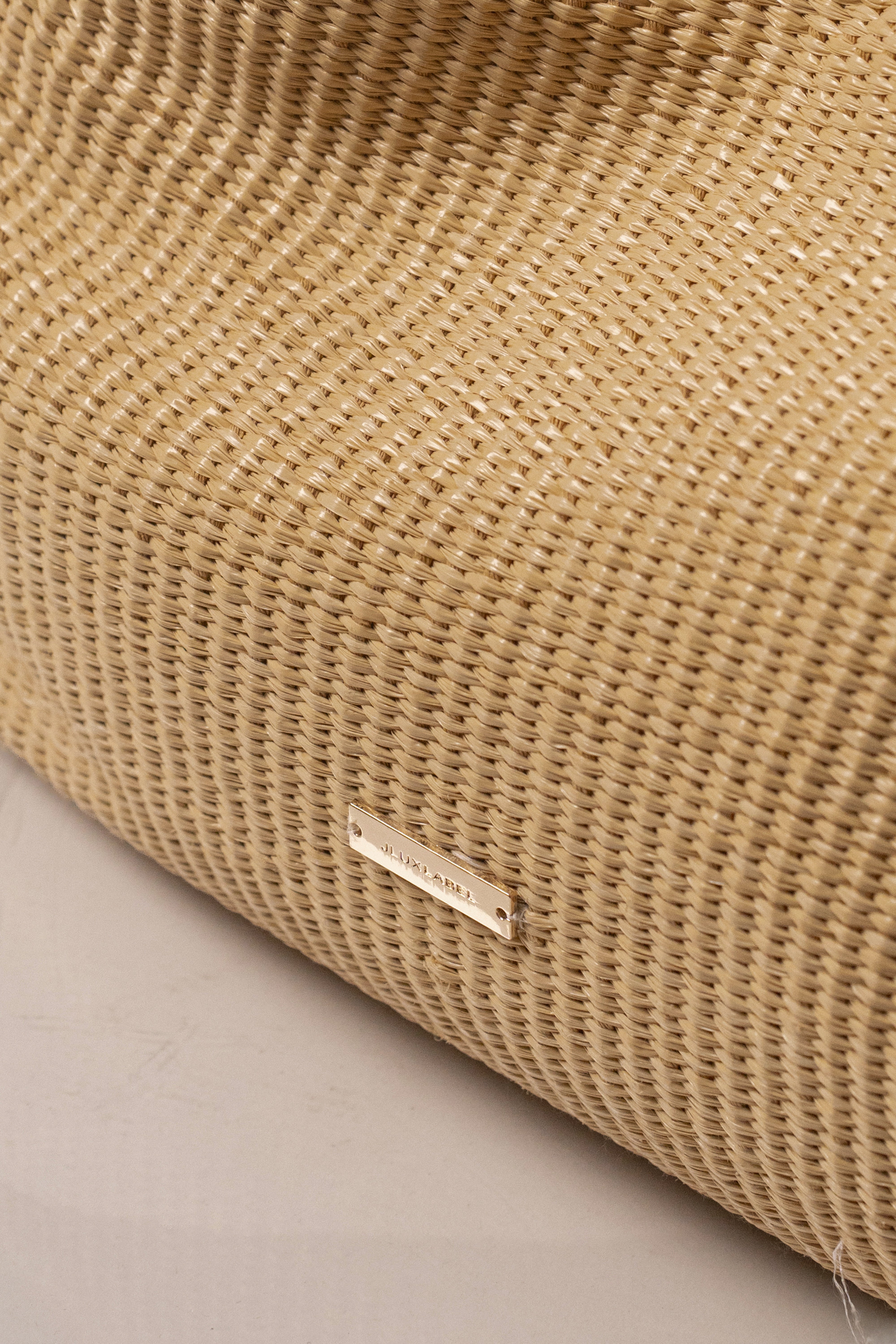 Natural Lana woven handbag by JLUXLABEL, showcasing a stylish, handcrafted accessory with intricate woven details and natural fibers.