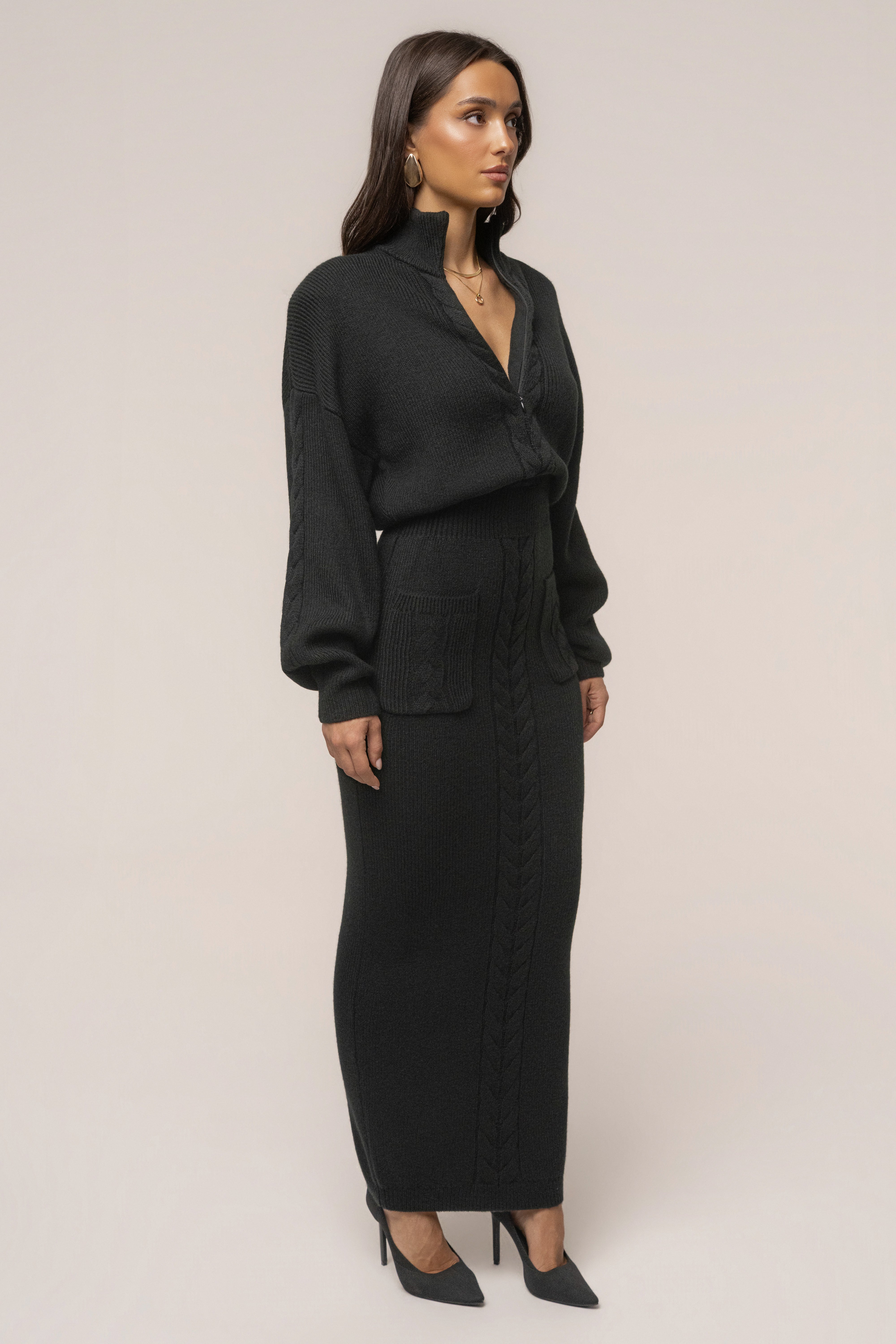 Black ribbed dress by JLUXLABEL featuring cozy, fitted design and long sleeves, perfect for casual or stylish occasions.