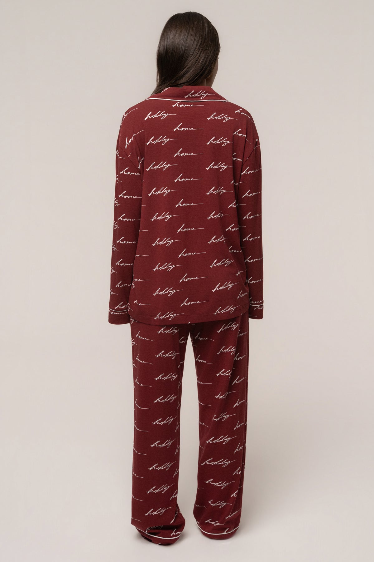 Burgundy JLUXLABEL adult pajama set for home holidays, featuring cozy long-sleeve top and matching pants in a festive design.