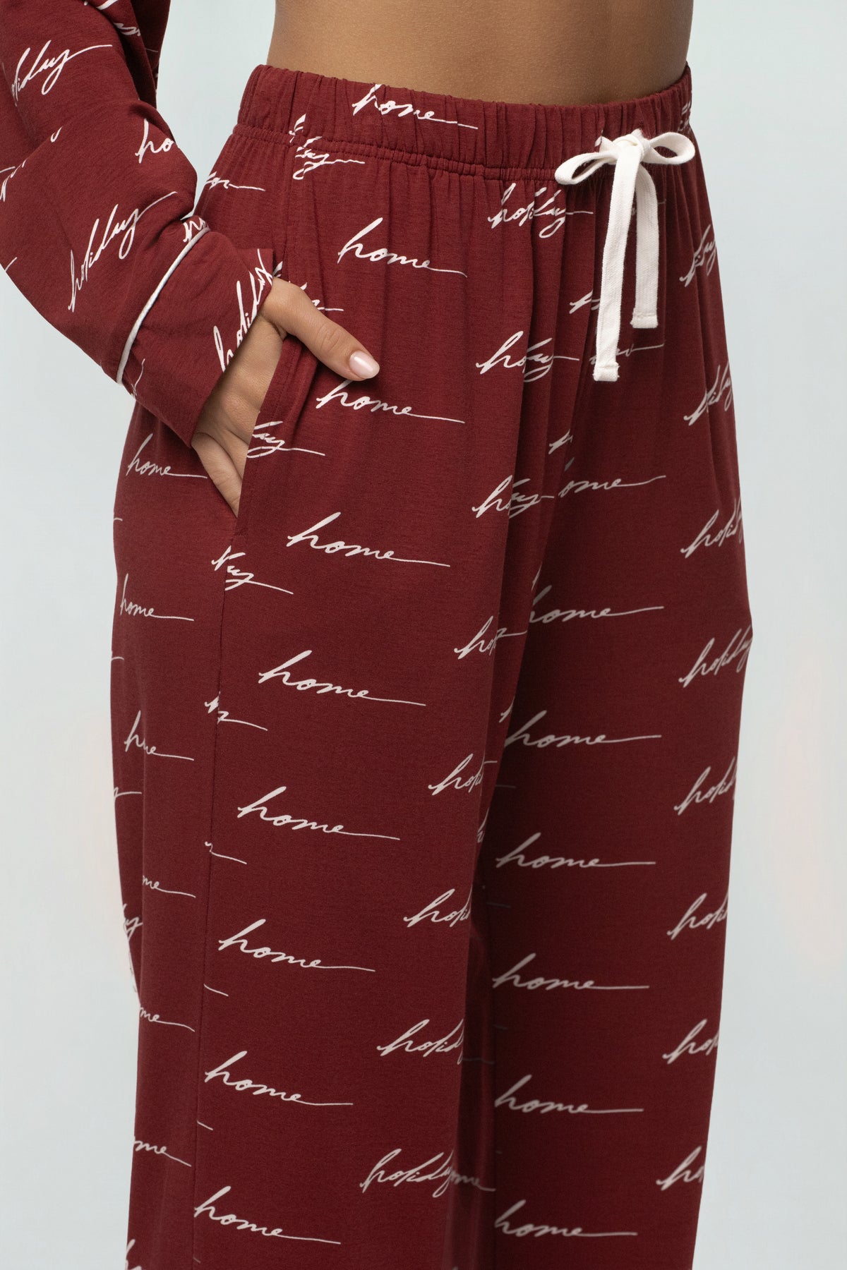 Burgundy JLUXLABEL adult pajama set with holiday-themed design, soft fabric, and relaxed fit for cozy home wear.