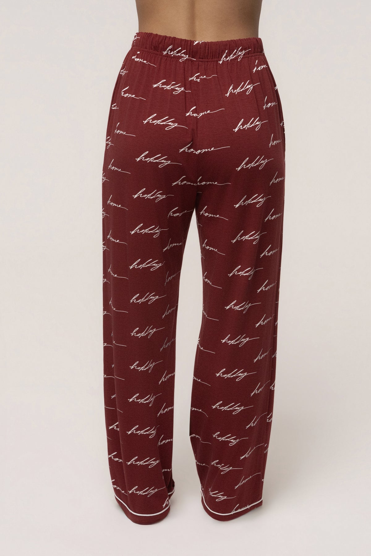 Burgundy adult pajama set from JLUXLABEL's Home For The Holidays collection, featuring a cozy, festive sleepwear set.