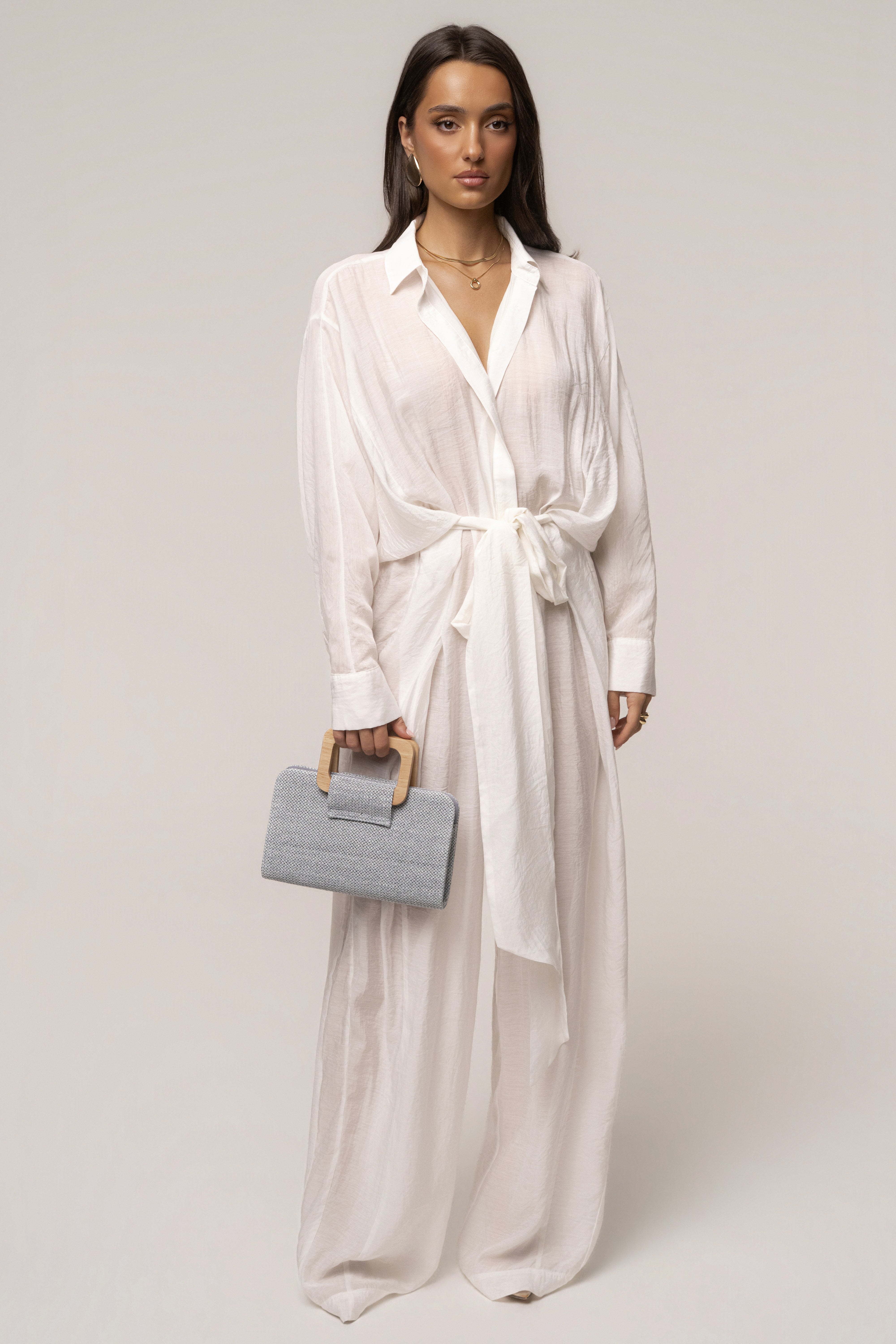 Blue Isola clutch bag by JLUXLABEL featuring a sleek design and compact size, perfect for accessories and evening outings.