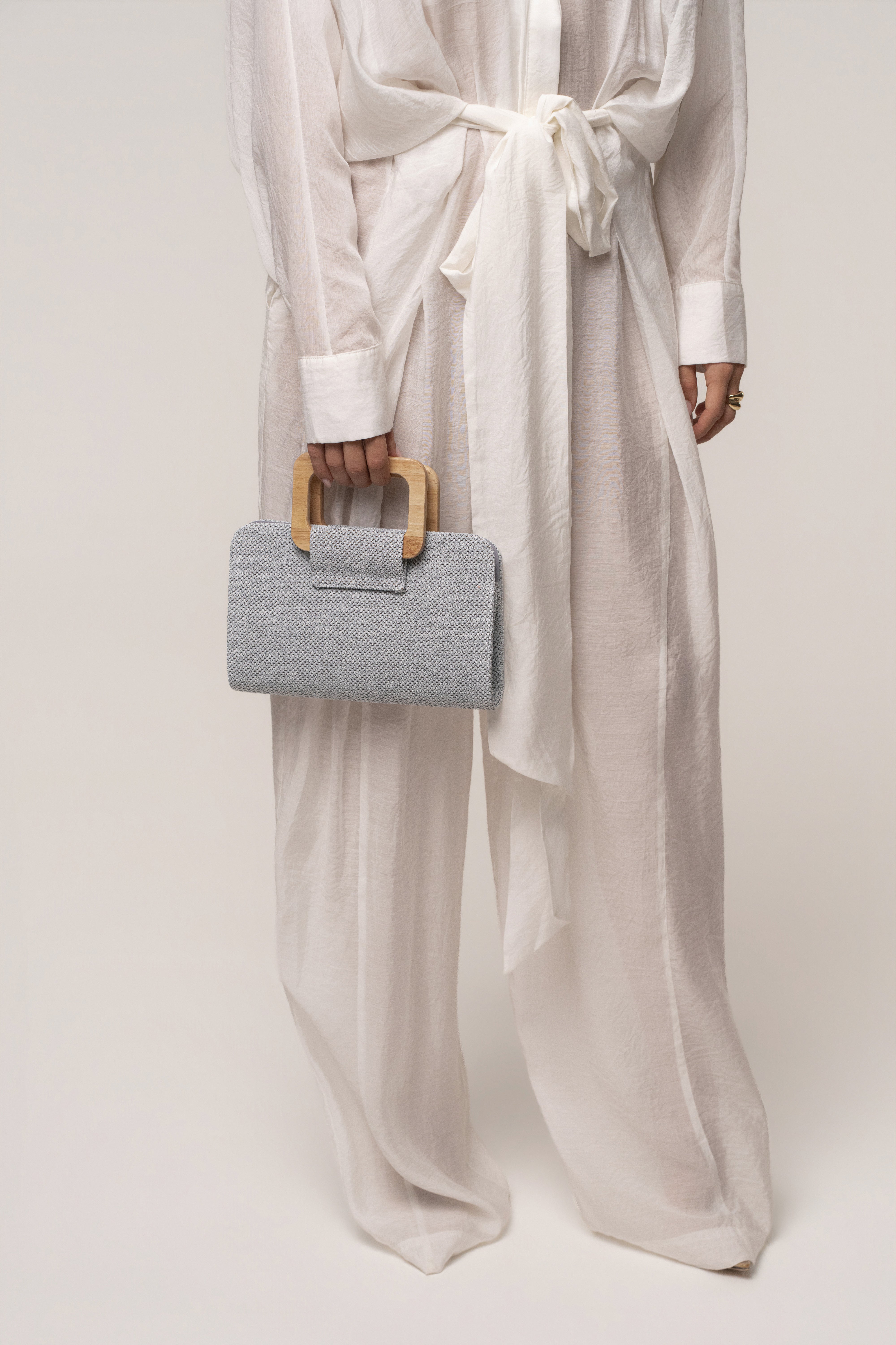 Blue Isola clutch by JLUXLABEL, stylish accessories bag with sleek design and vibrant color for elegant occasions.