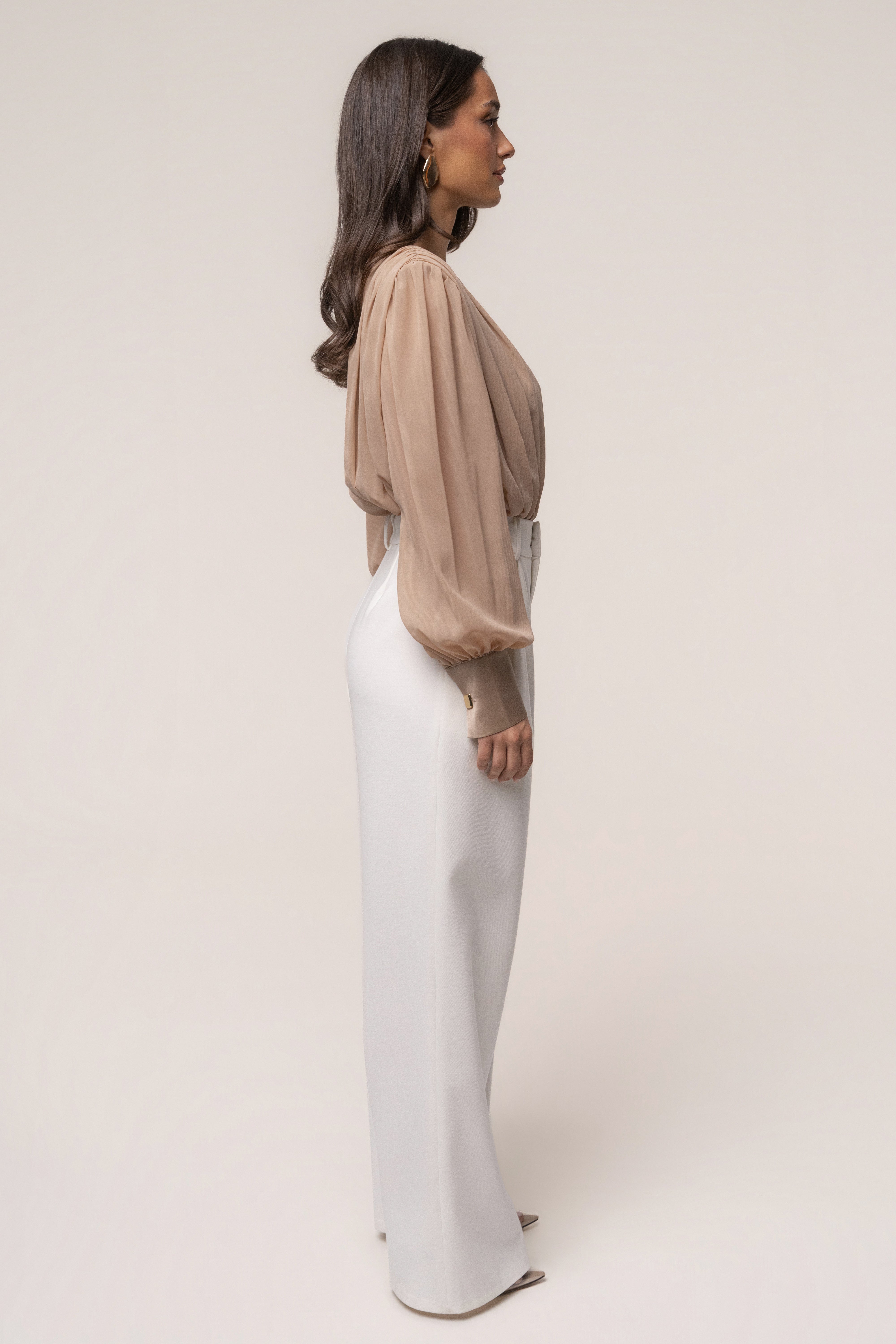 Tan refined pleated chiffon top by JLUXLABEL, featuring elegant pleats and lightweight fabric, perfect for sophisticated casual wear.