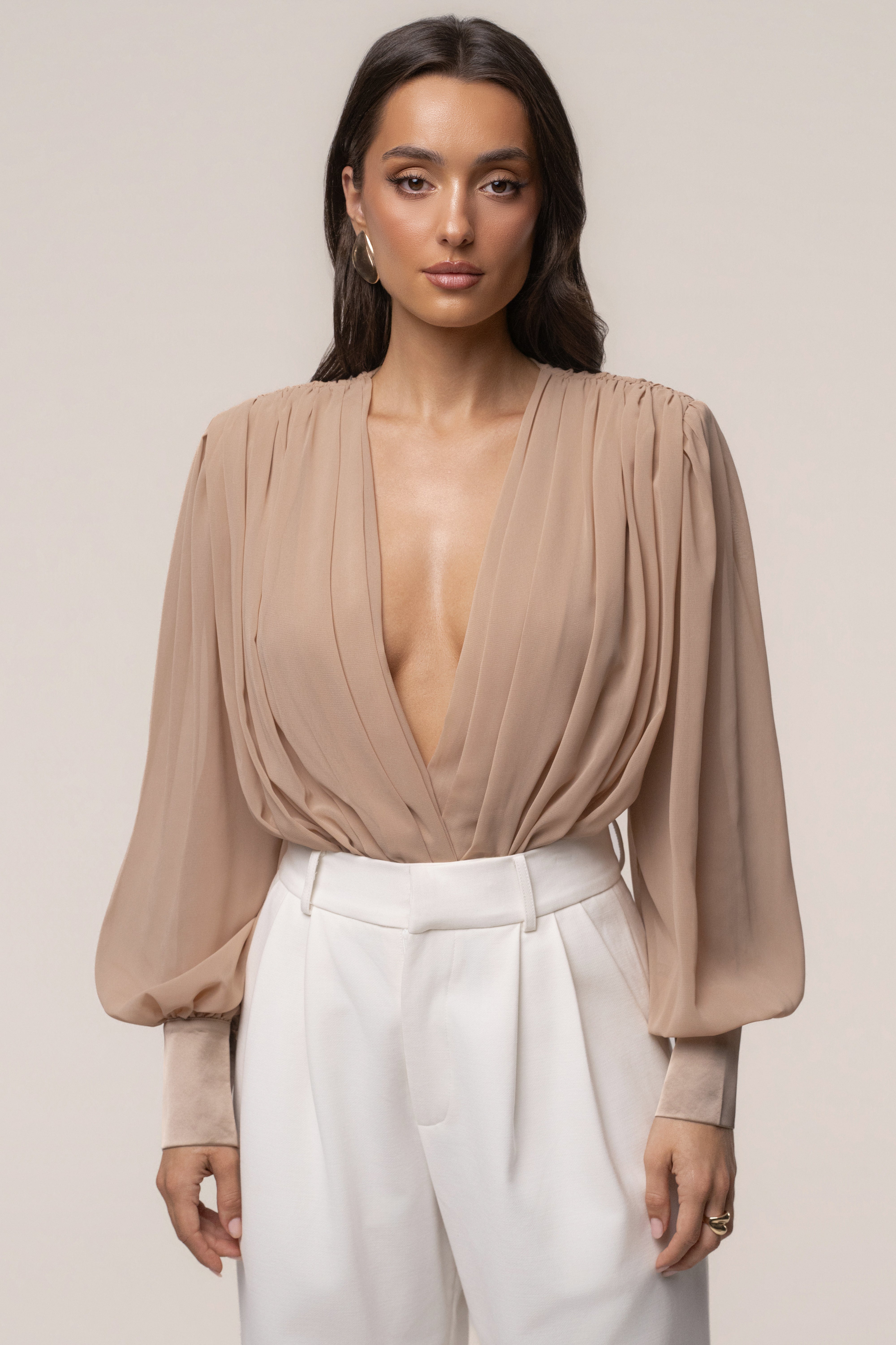 Tan refined pleated chiffon top by JLUXLABEL featuring a lightweight, elegant design with pleats and a flowing silhouette.