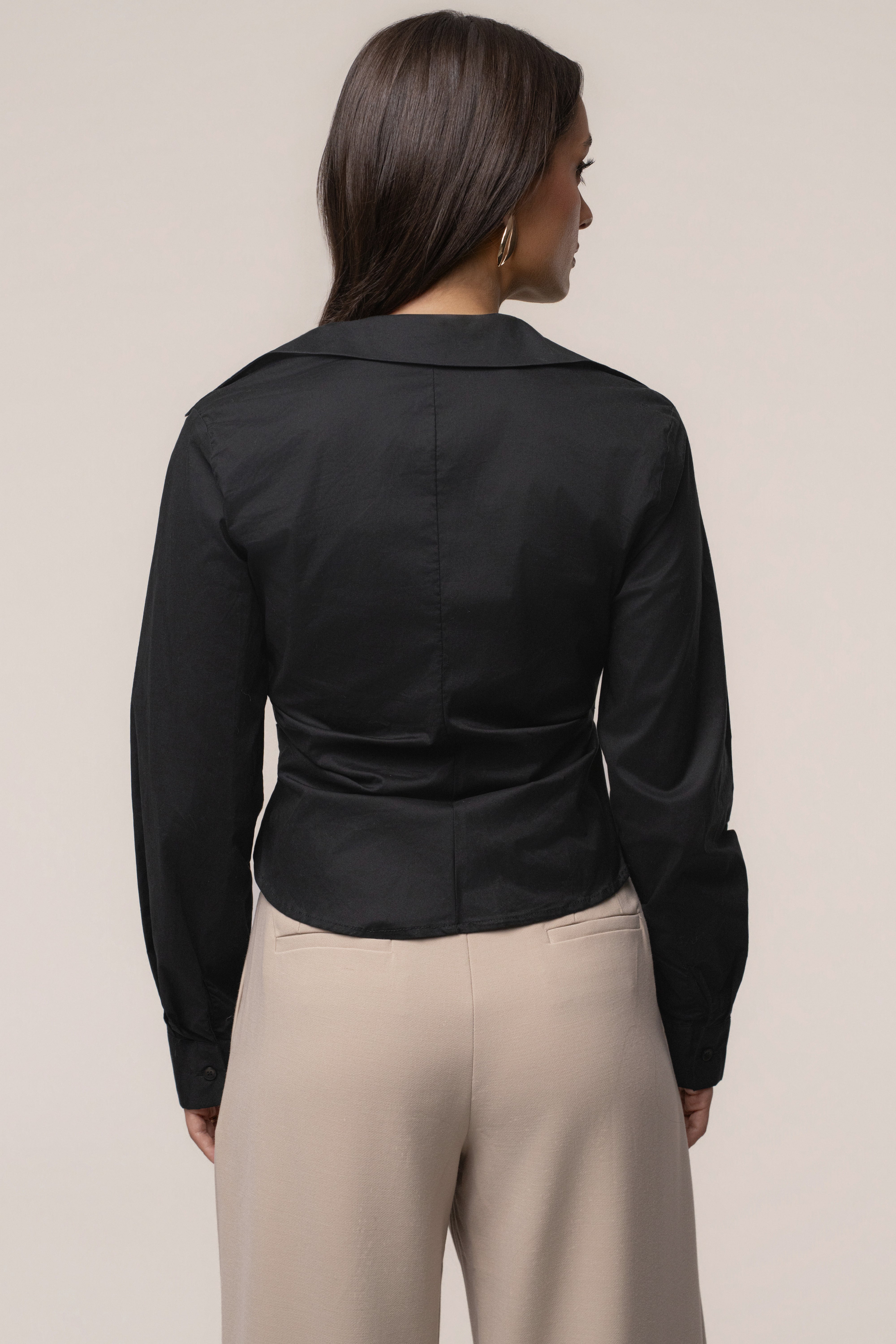 Black Sculpt and Form blouse by JLUXLABEL, showcasing a stylish fitted top with a high neckline and sleek fabric.