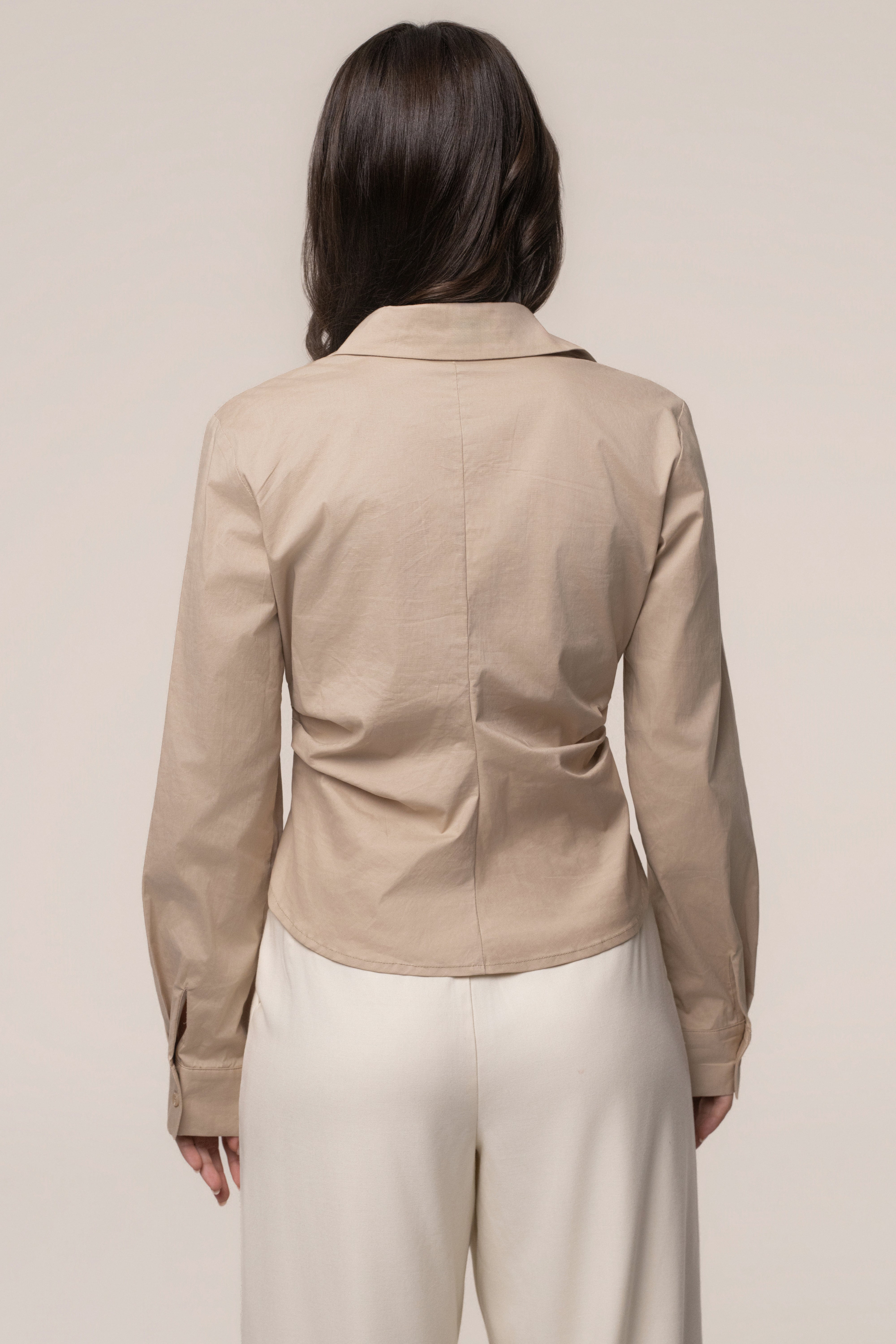 Beige Sculpt and Form blouse by JLUXLABEL, featuring a stylish top with fitted silhouette and elegant design.
