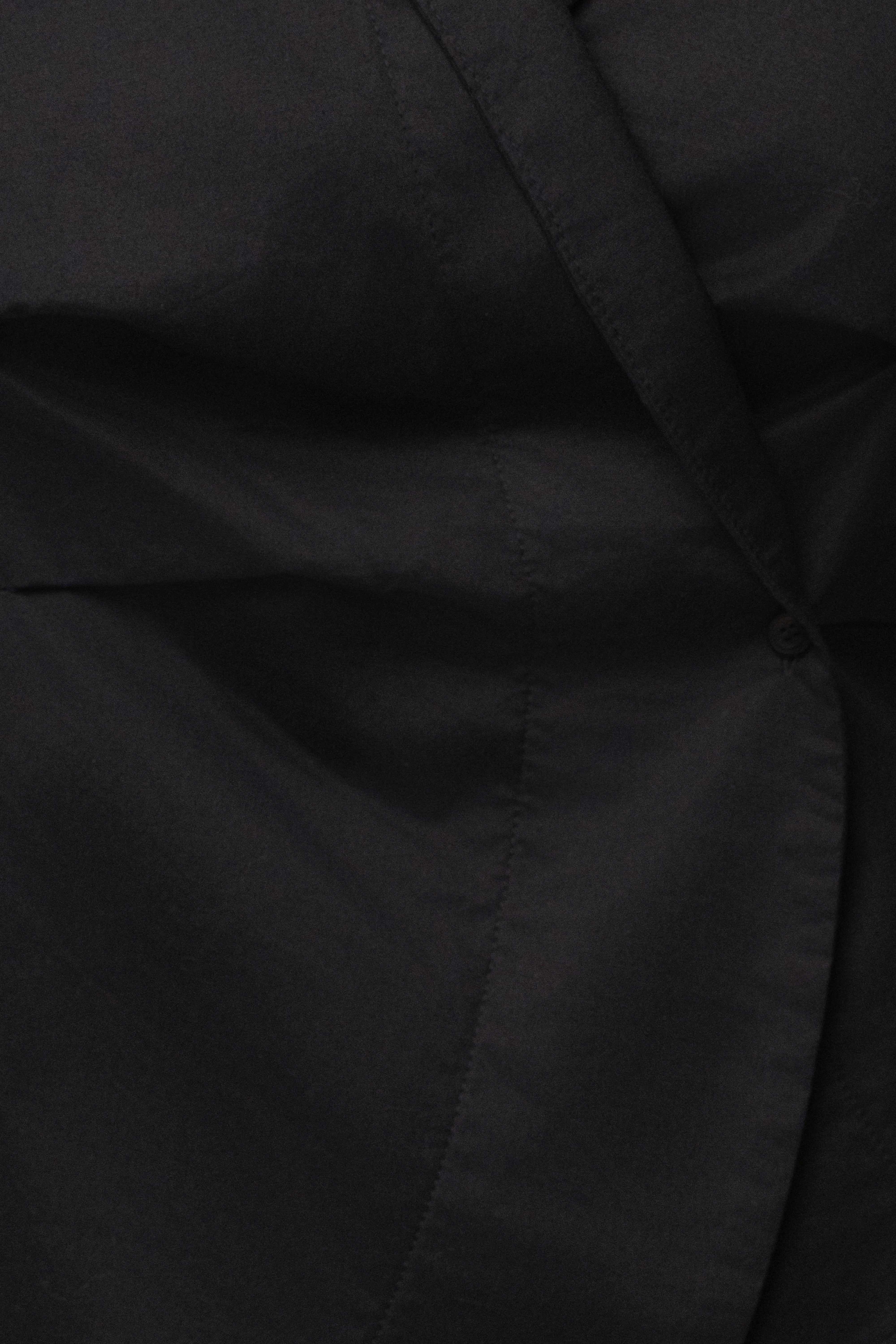 Black Sculpt and Form blouse by JLUXLABEL, featuring a fitted design and stylish top with smooth fabric and structured silhouette.