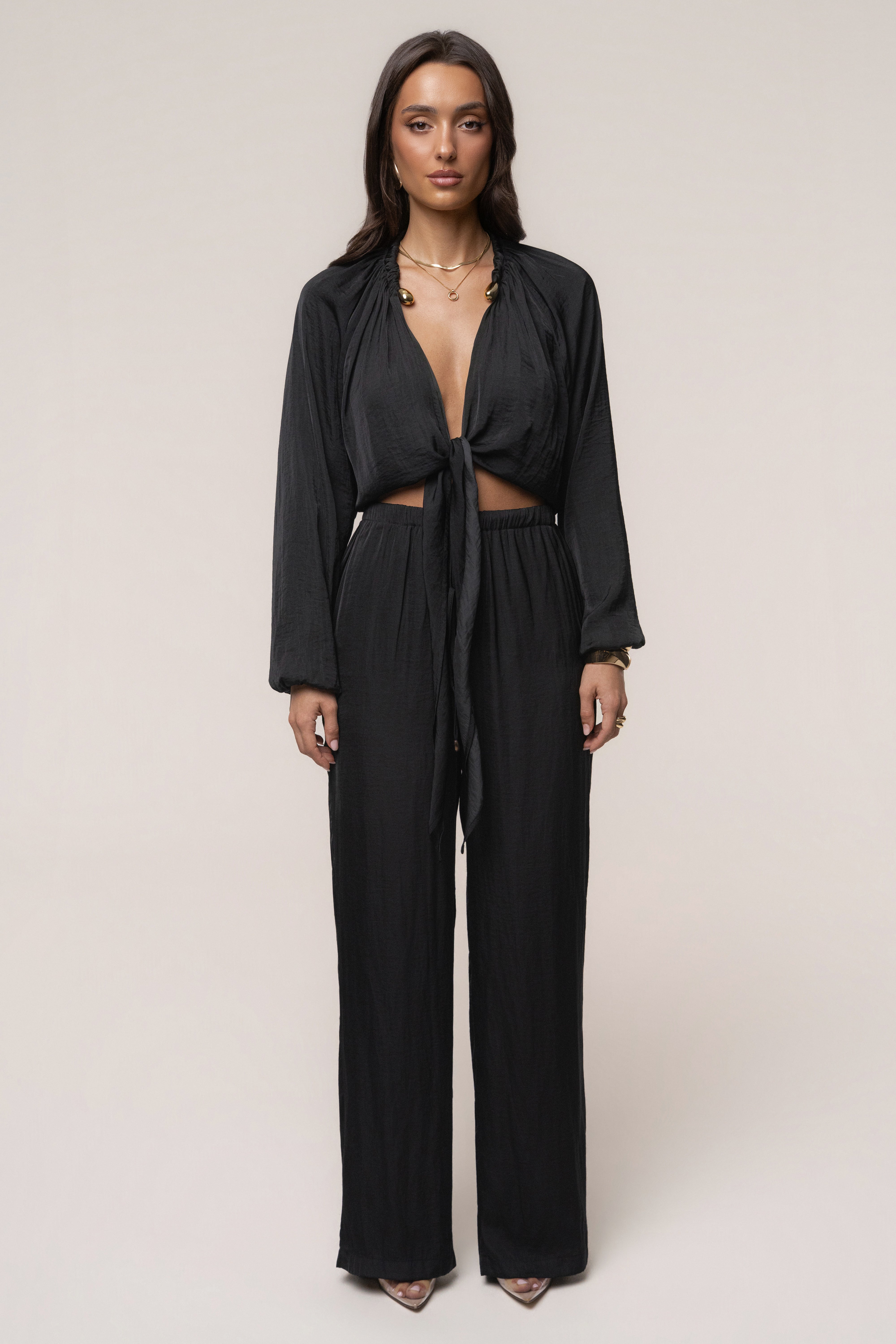 Black Seaside Glow Top by JLUXLABEL featuring a stylish, flowy design with a v-neck and short sleeves.