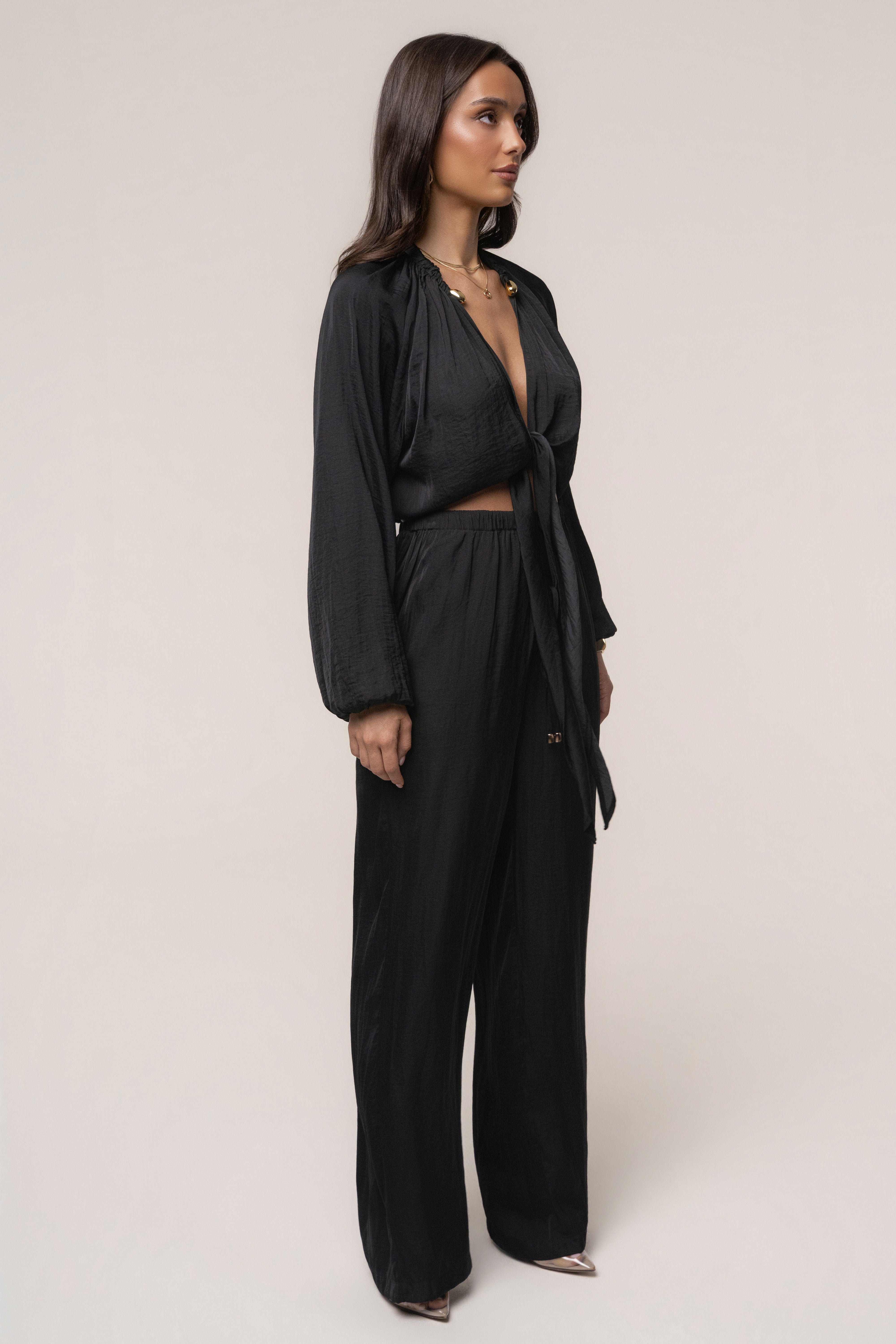 Black seaside glow top by JLUXLABEL, featuring a stylish design with a comfortable fit, perfect for casual or evening wear.