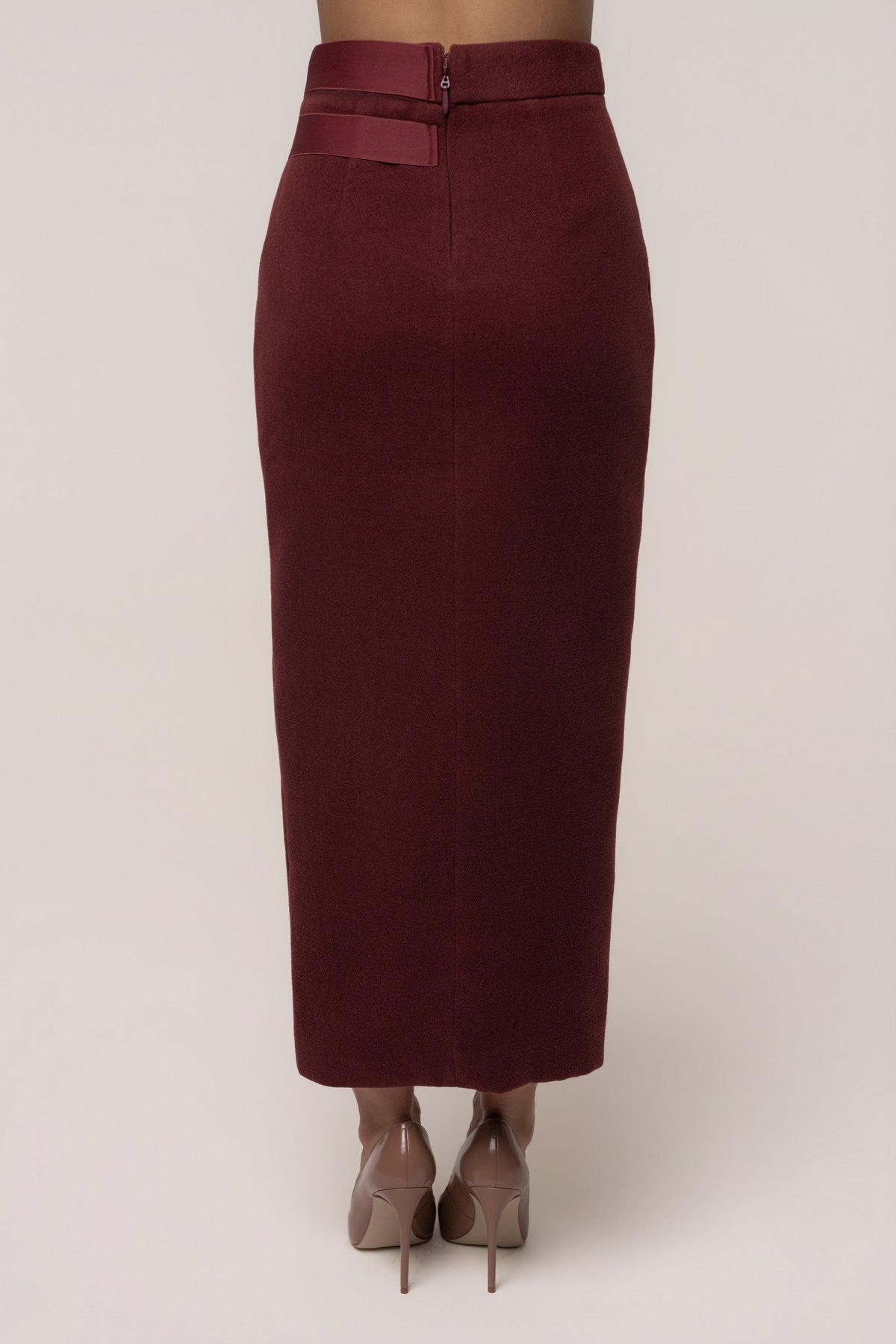 Burgundy Gisele slit skirt by JLUXLABEL, showing the flowing fabric and high slit detail on a stylish bottoms product image.