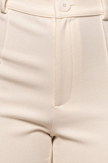 Ivory Arlette Trousers waist close-up showing button and front seam