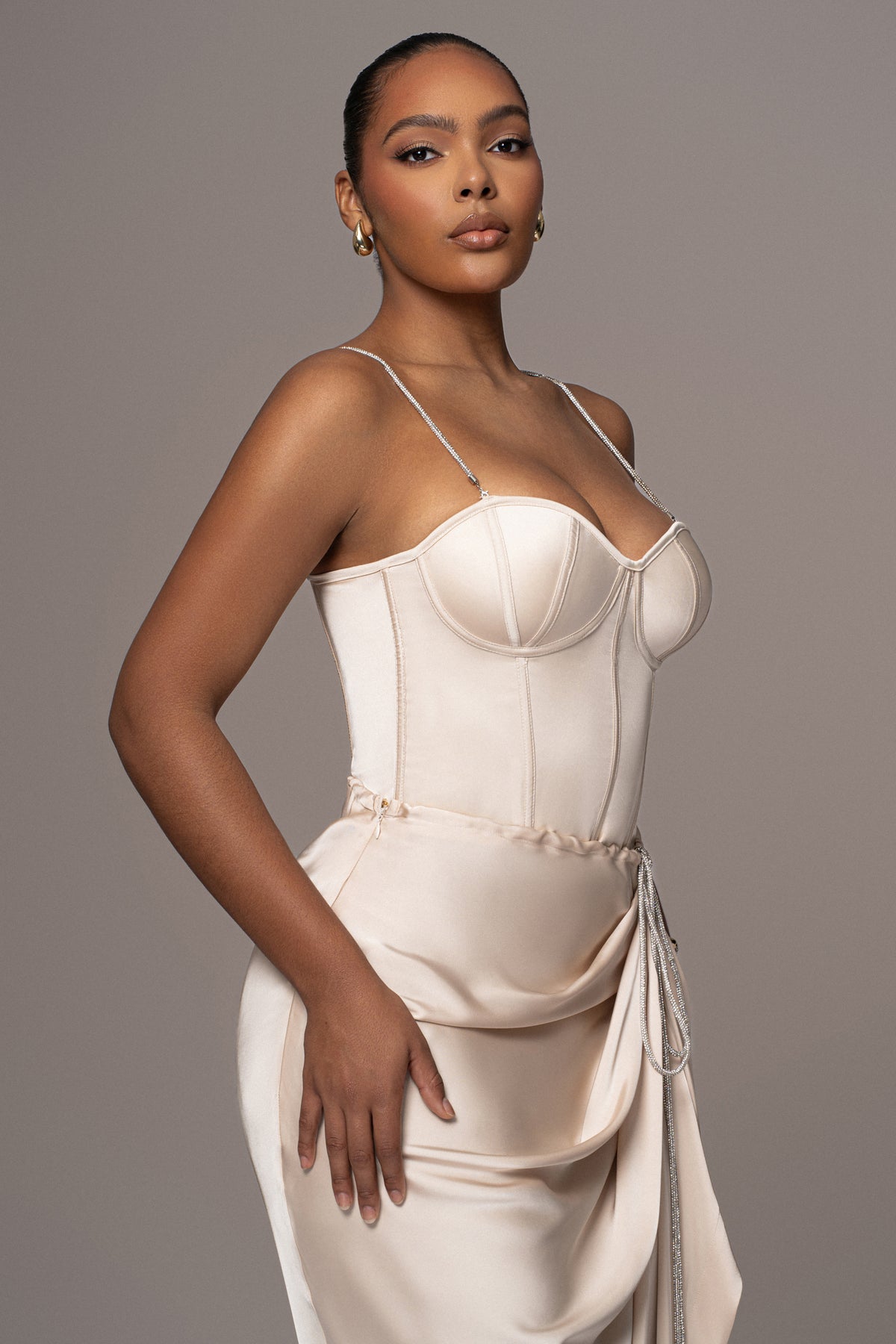 JLUXLABEL Champagne Leo Matte Satin Bustier top, close-up of the fitted satin bustier with matte finish and structured design.