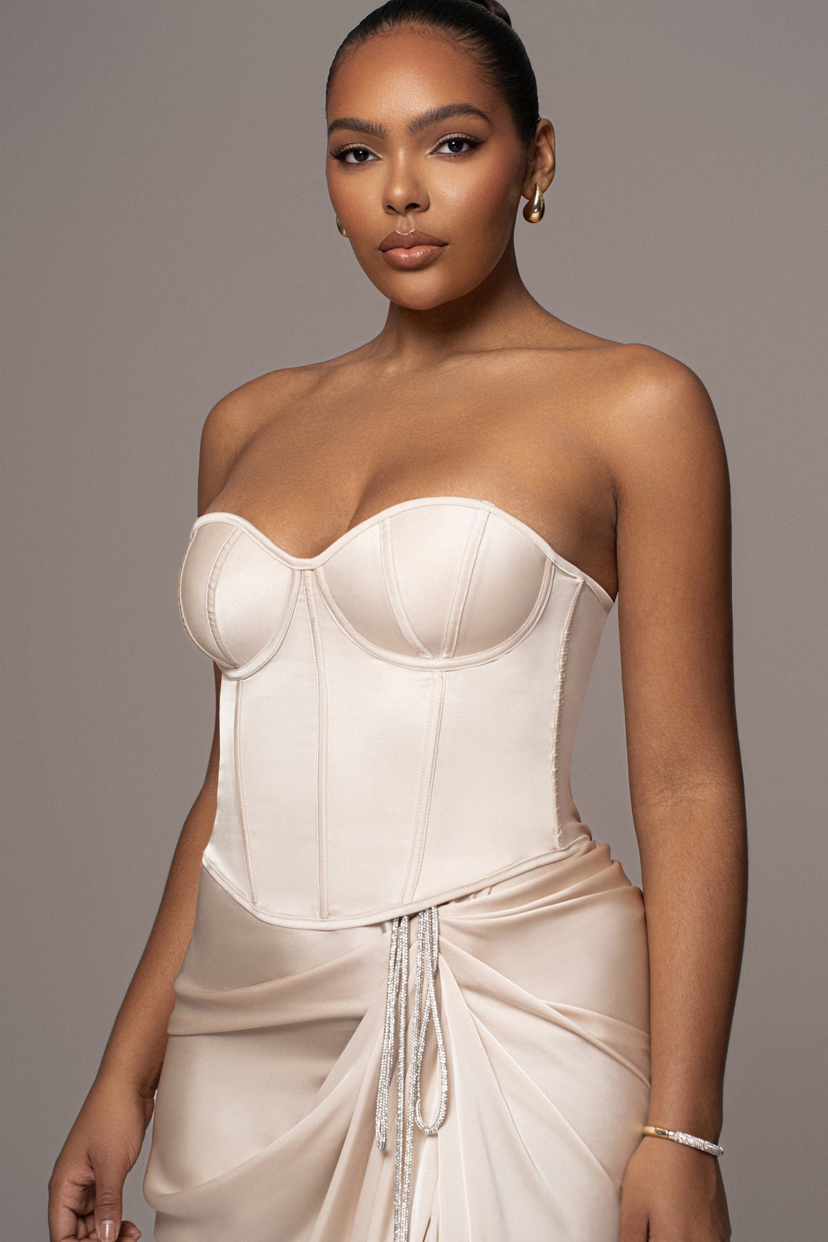 JLUXLABEL Champagne Leo matte satin bustier top, stylish and elegant satin fabric with structured design and adjustable straps.