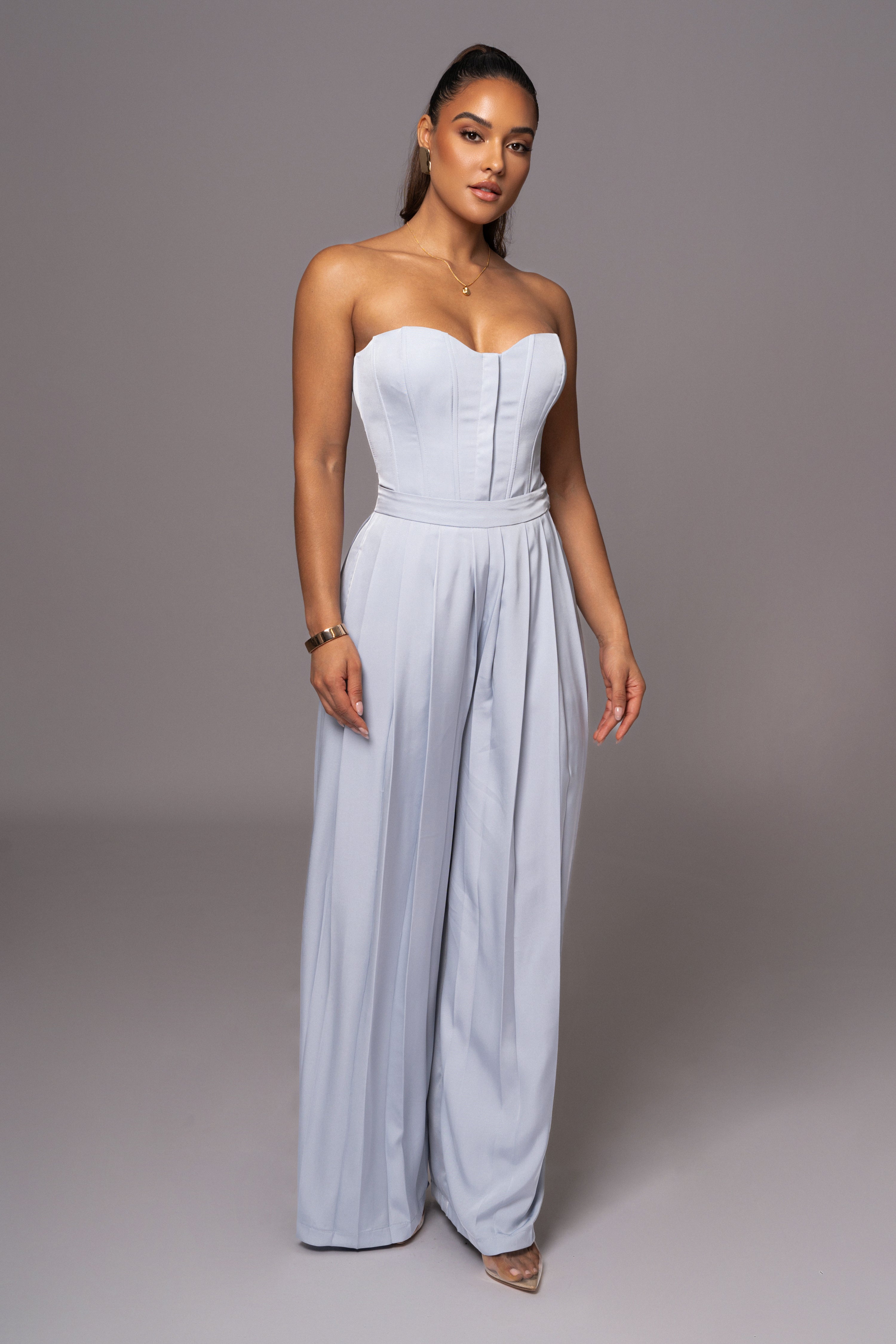 Blue Clara wide-leg pleated trousers by JLUXLABEL, showing a full view of the stylish, flowy bottoms with pleats and a relaxed fit.