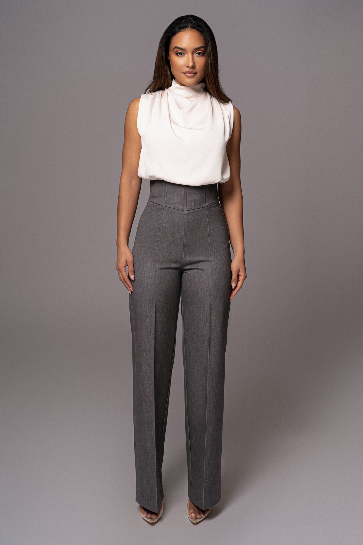JLUXLABEL Buttercream Desiree mock neck top shown in a stylish lifestyle setting, featuring a fitted design and soft fabric.