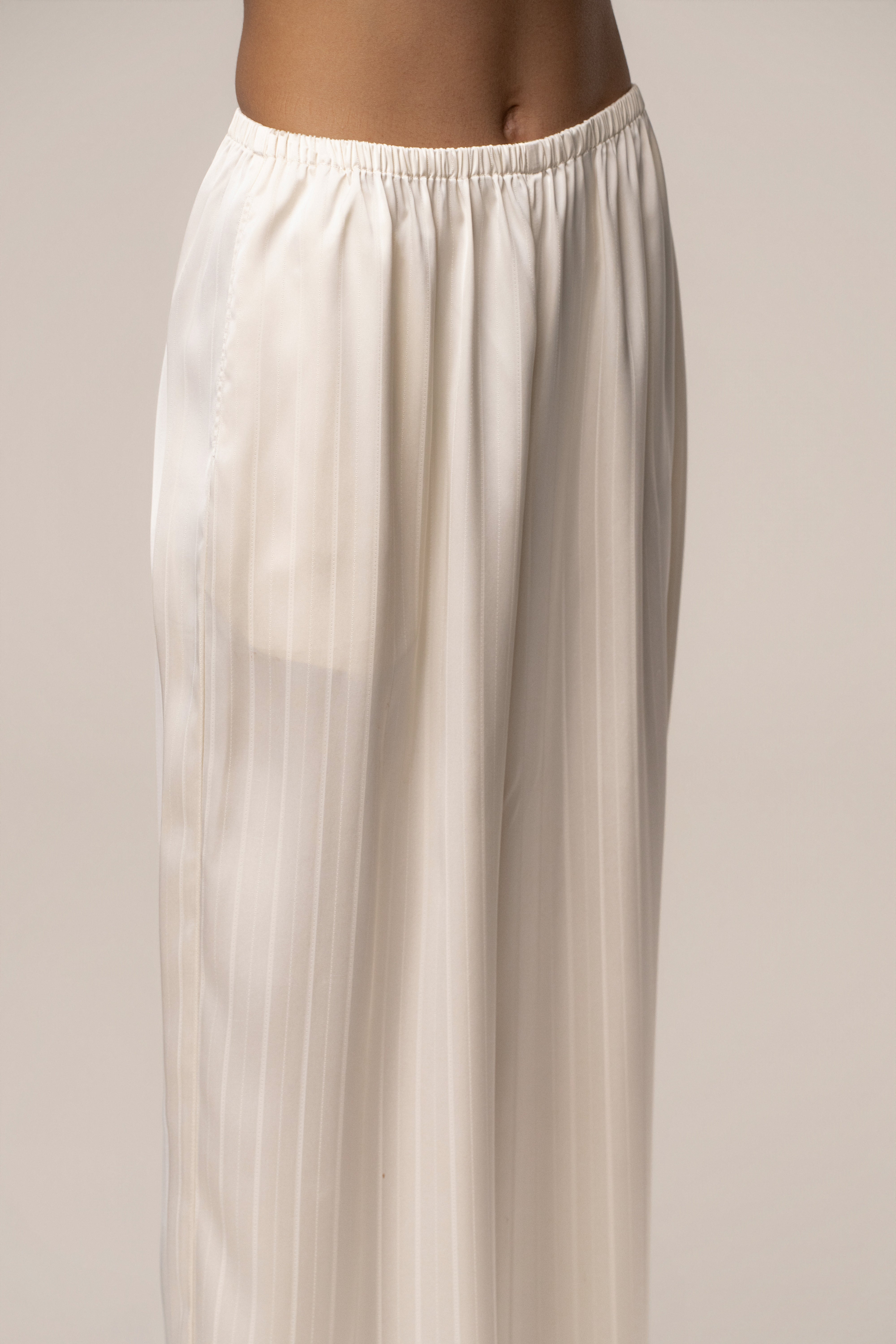 Ivory JLUXLABEL The Standard Pant, stylish women's bottoms with a relaxed fit and high waist, shown on a model.