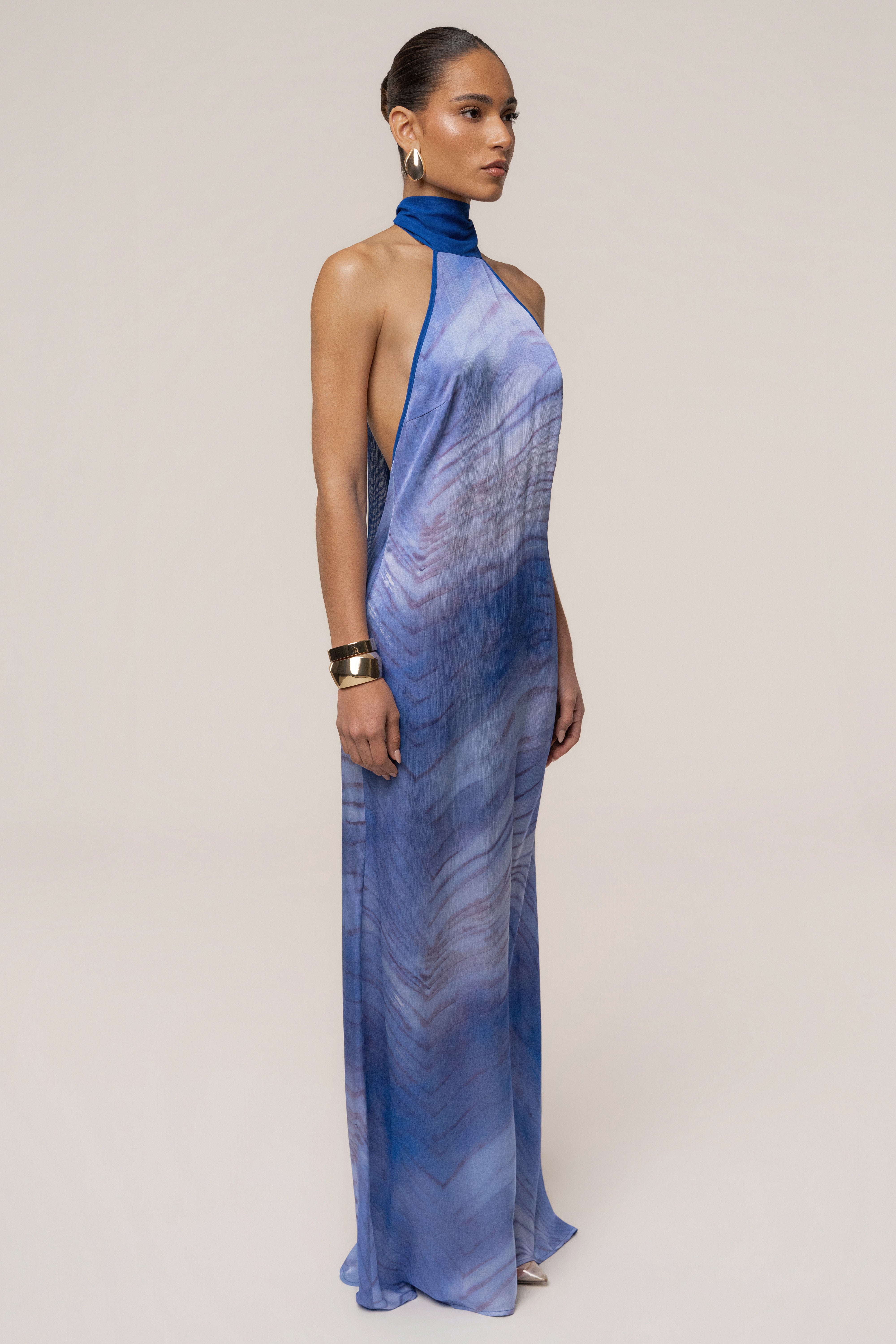 Blue Sunset Waves maxi dress from JLUXLABEL featuring flowing fabric and ocean-inspired wave pattern, perfect for summer occasions.