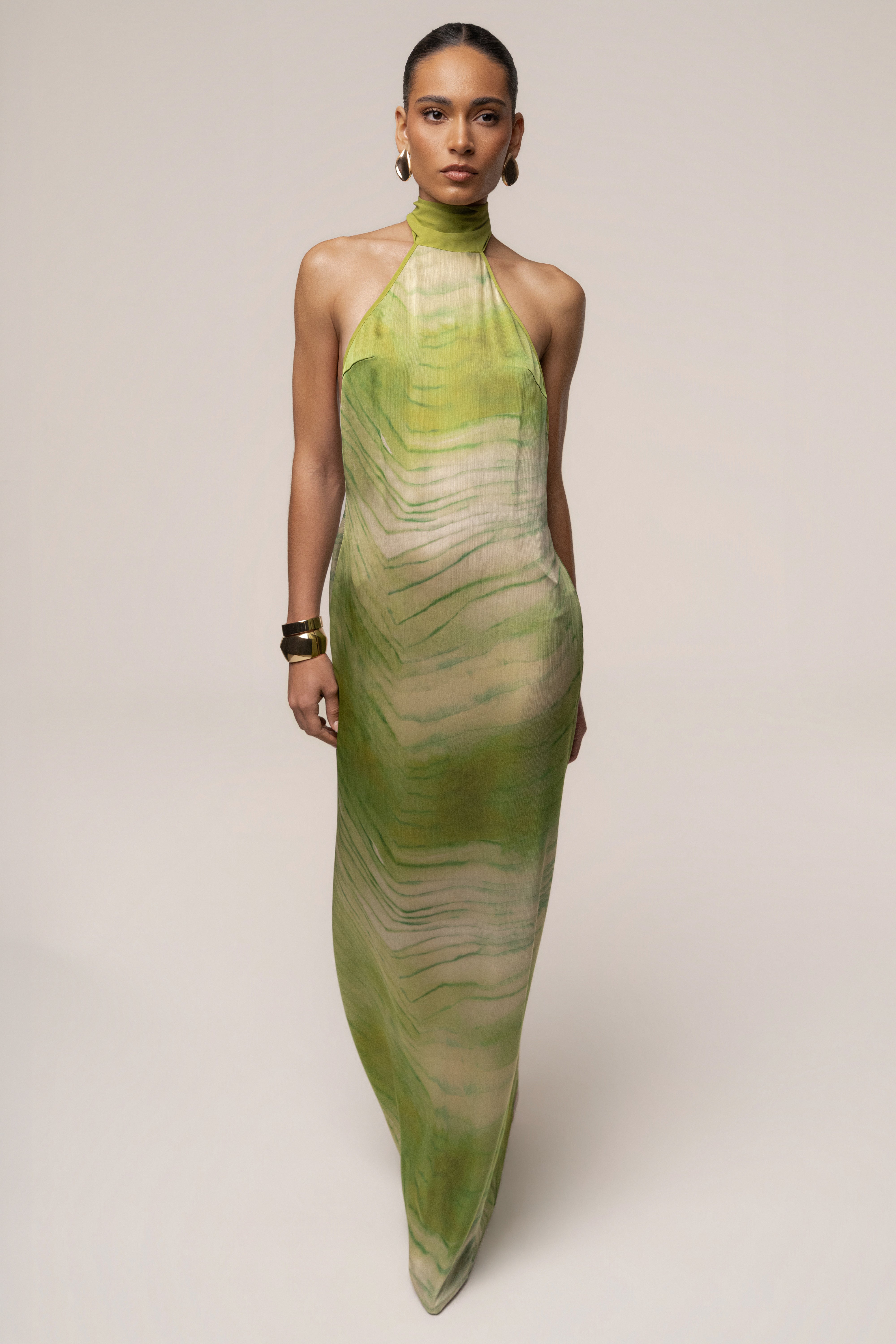 Green Sunset Waves Maxi Dress by JLUXLABEL featuring a flowing silhouette and vibrant wave-inspired pattern.