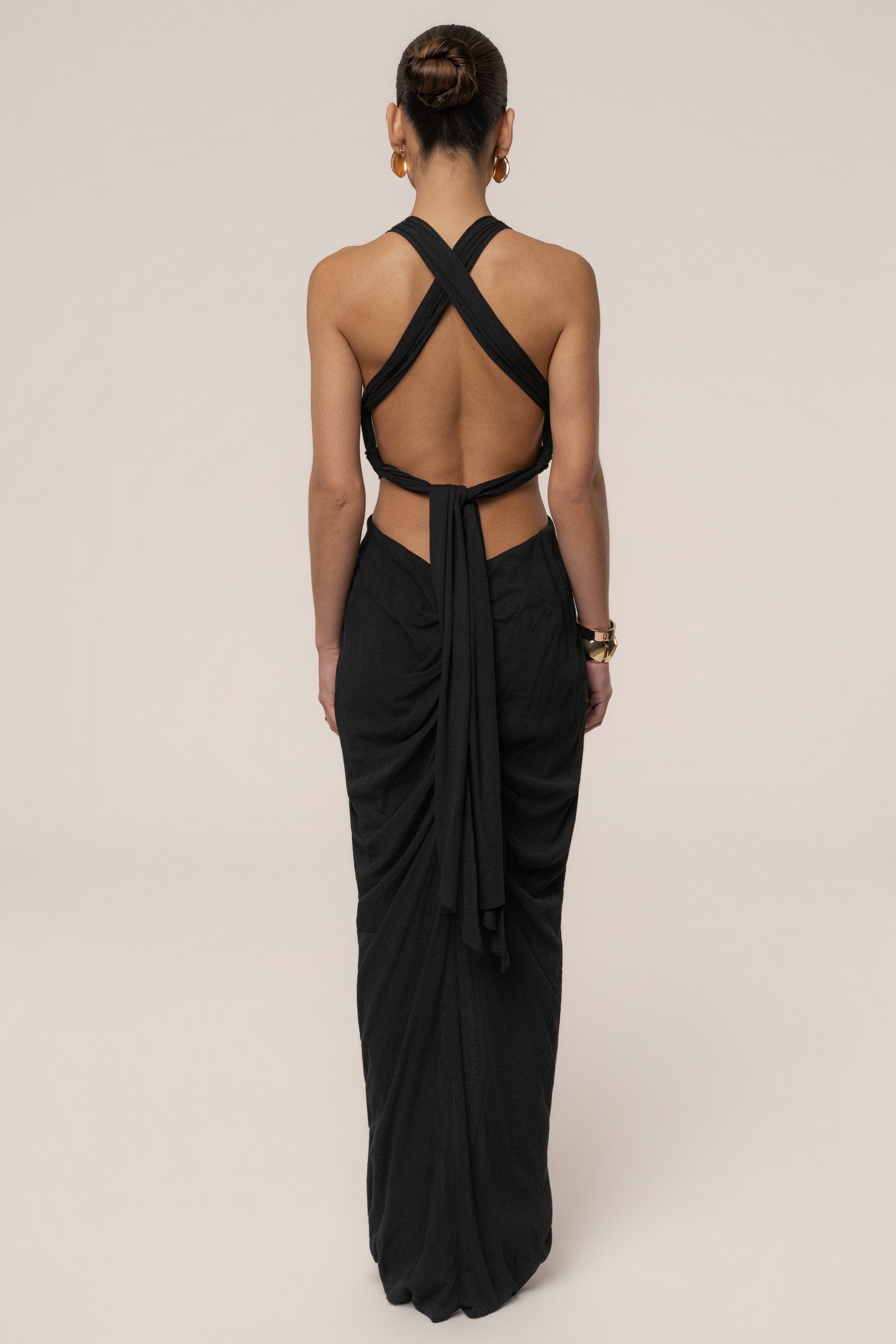 Black Warm Sunsets Maxi Dress by JLUXLABEL featuring a flowing silhouette and vibrant sunset-inspired print.