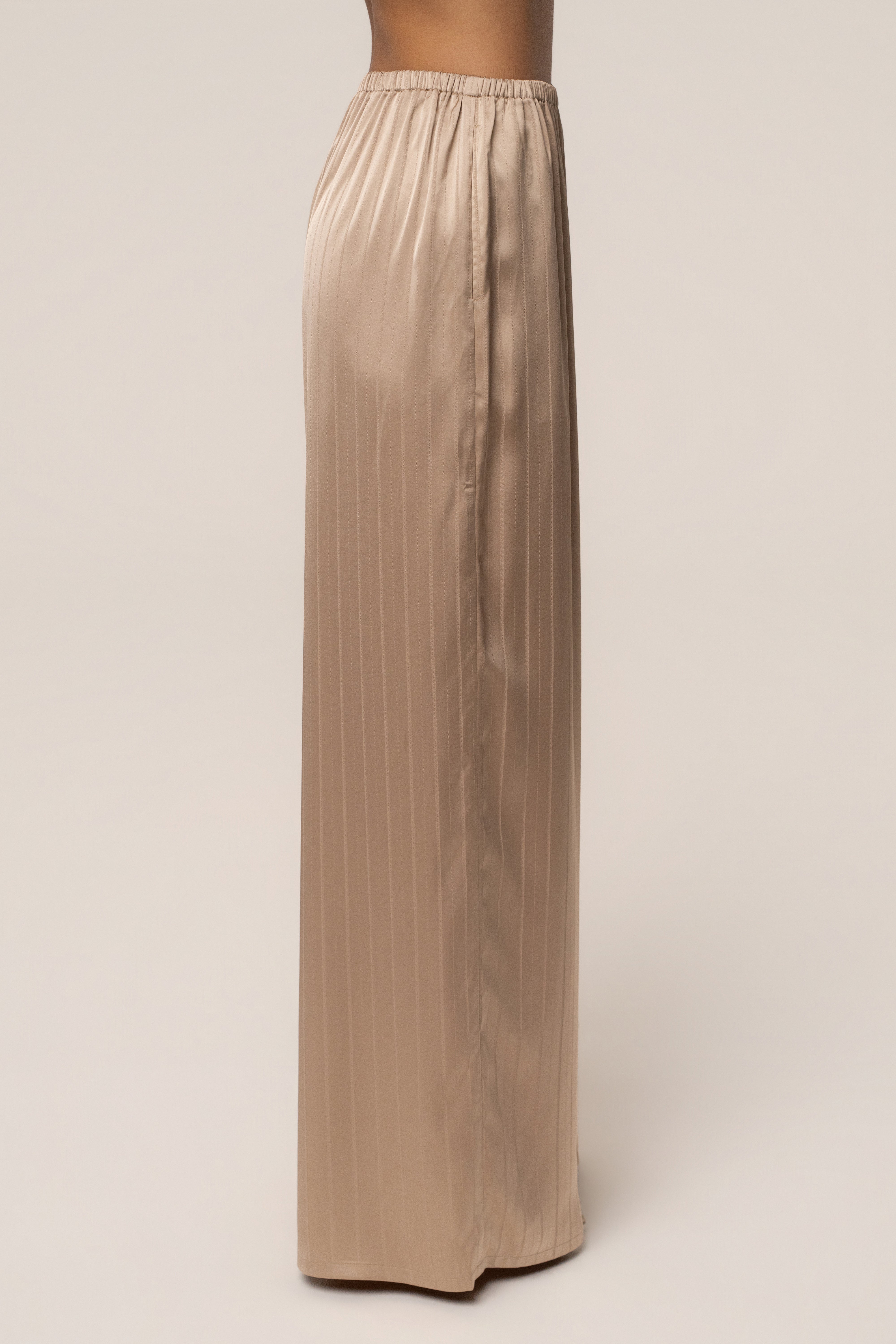 JLUXLABEL Stone The Standard Pant, stylish women's bottoms with a relaxed fit and neutral stone color, shown on a model.