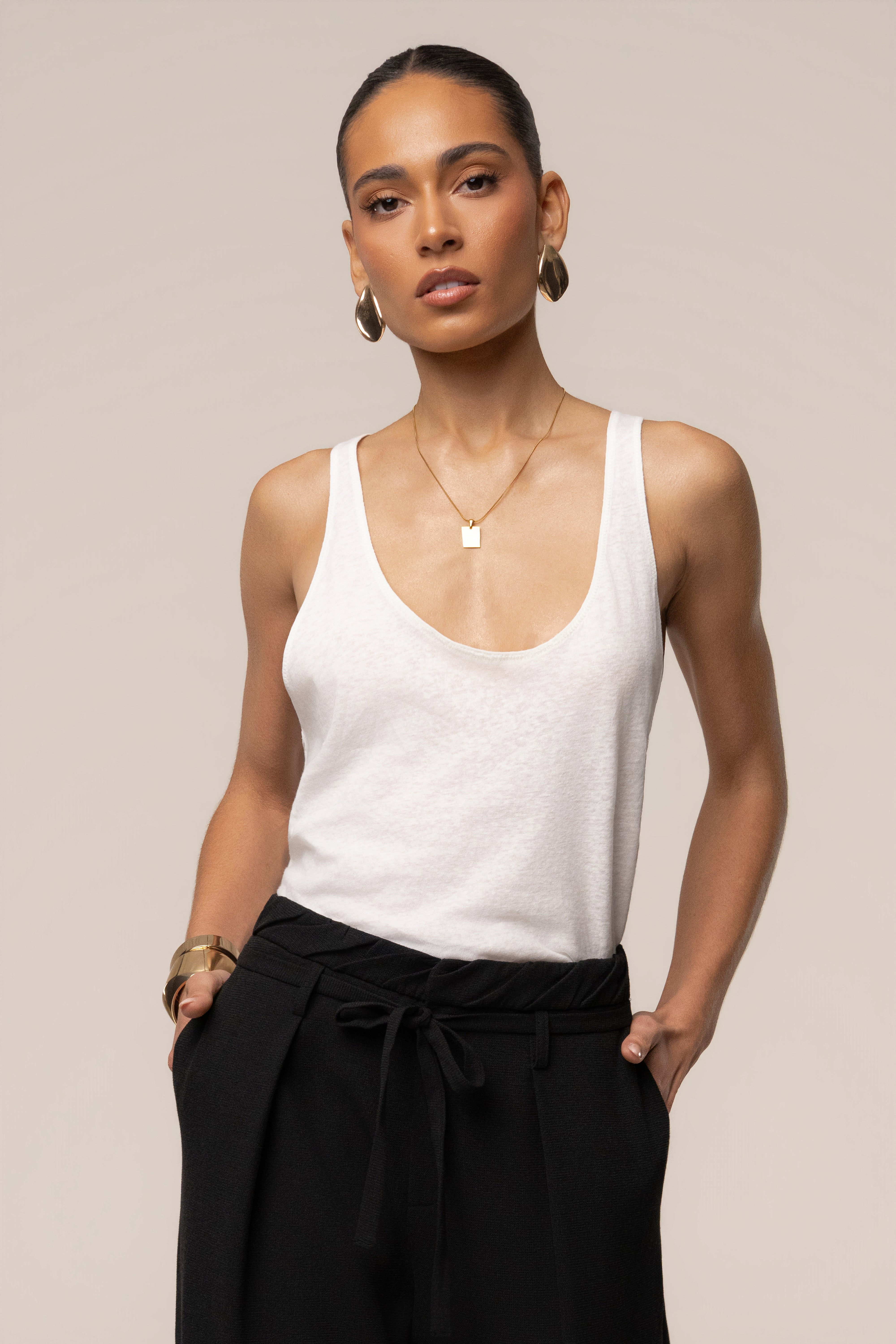 Ivory classic scoop neck tank top by JLUXLABEL, featuring a sleeveless design and soft fabric for a casual, stylish look.