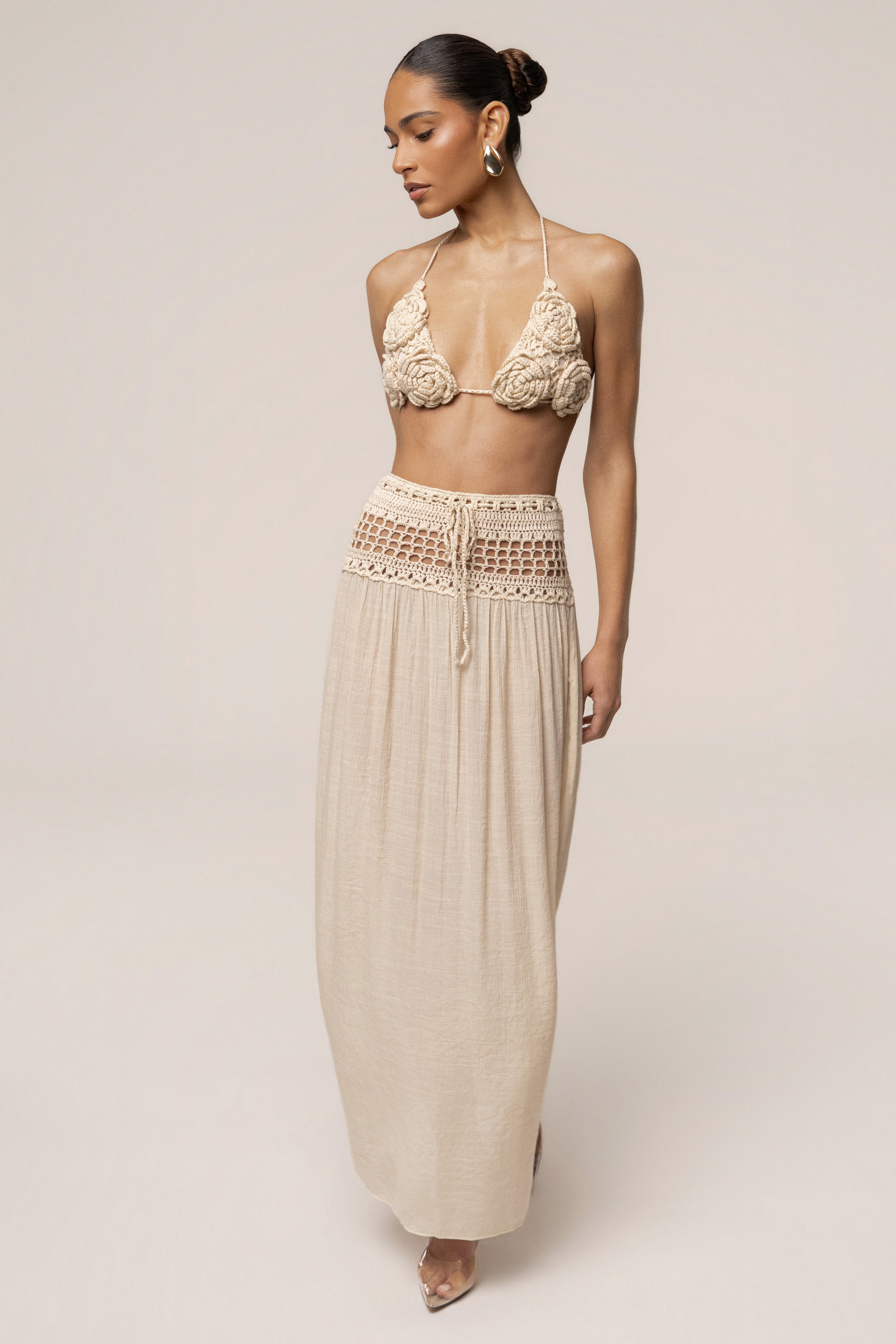 Beige JLUXLABEL resort crochet maxi skirt with a flowy design, perfect for warm weather and casual summer outings.