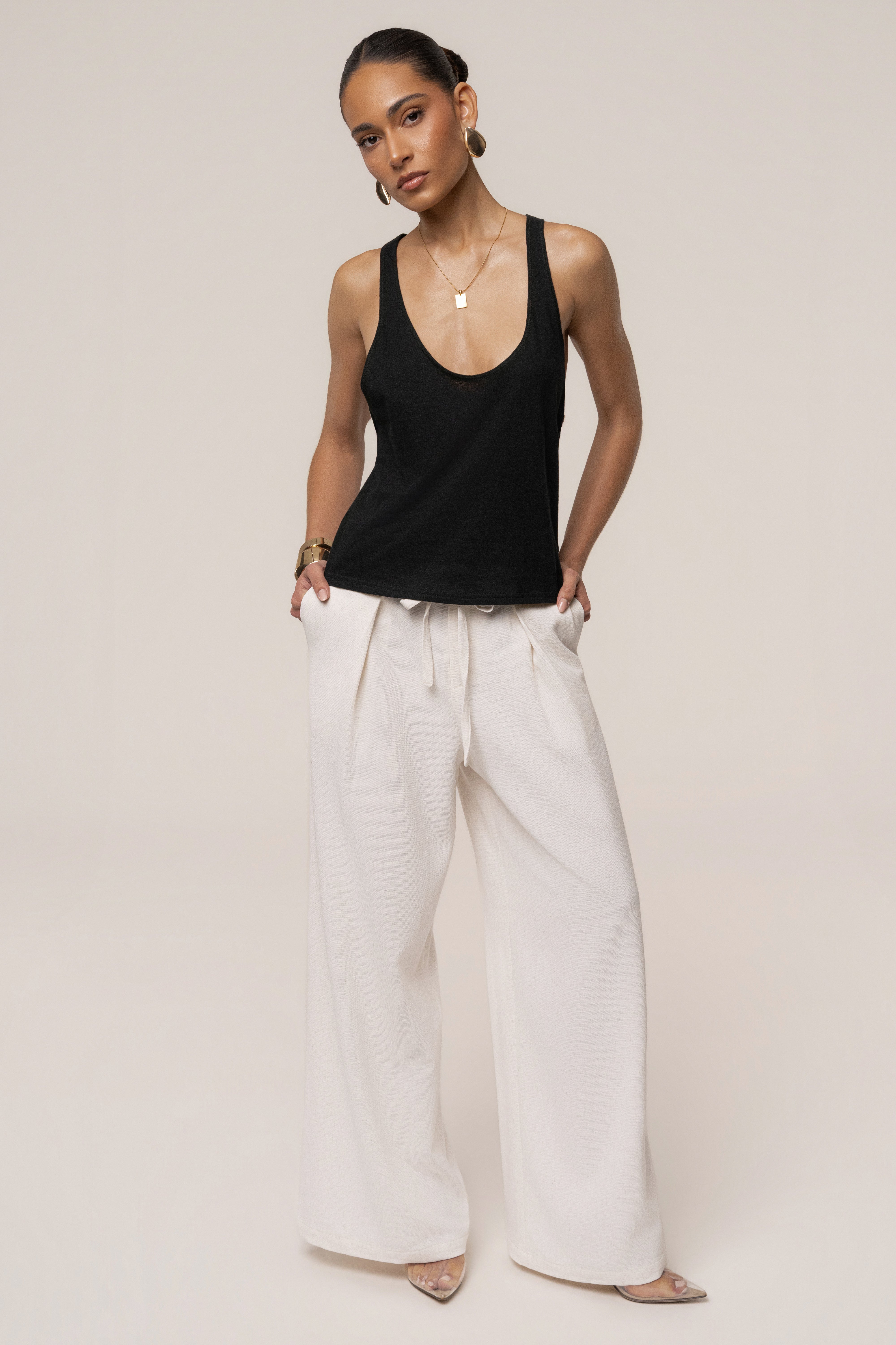 Black classic scoop neck tank top by JLUXLABEL, featuring a simple sleeveless design and comfortable fit.