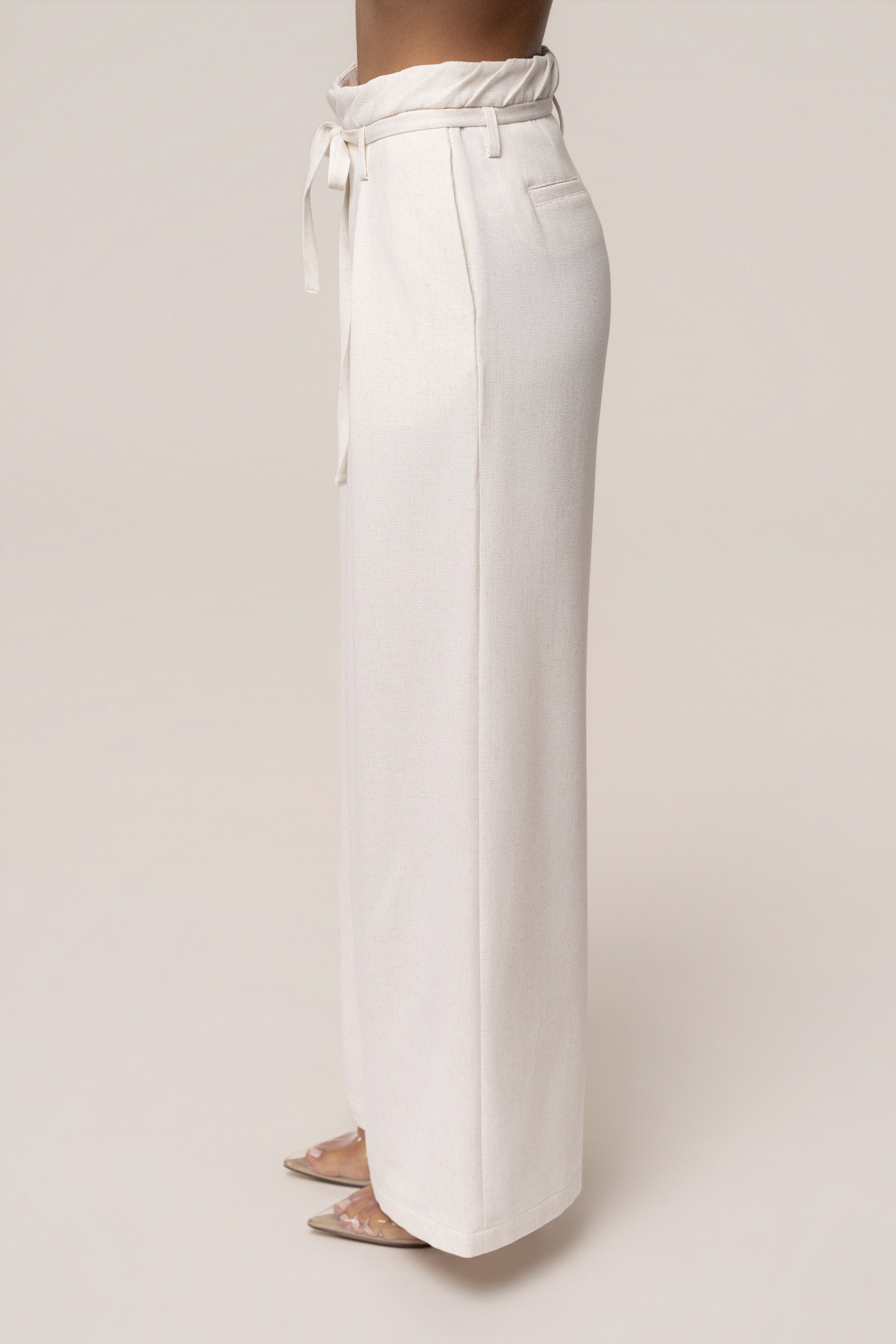 Ivory JLUXLABEL refined ease wide-leg pants displayed on a model, showcasing the relaxed fit and stylish design.