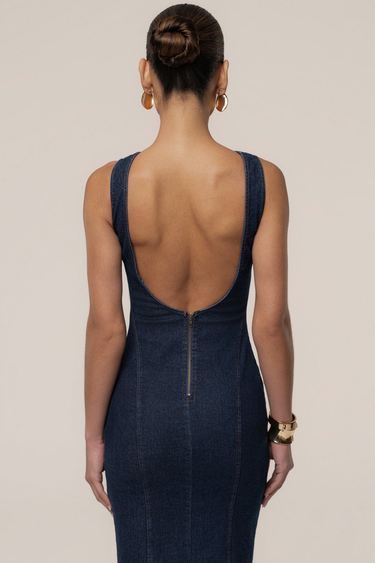 Dark denim sculpt maxi dress by JLUXLABEL, featuring a fitted silhouette and flowing length, perfect for stylish casual wear.