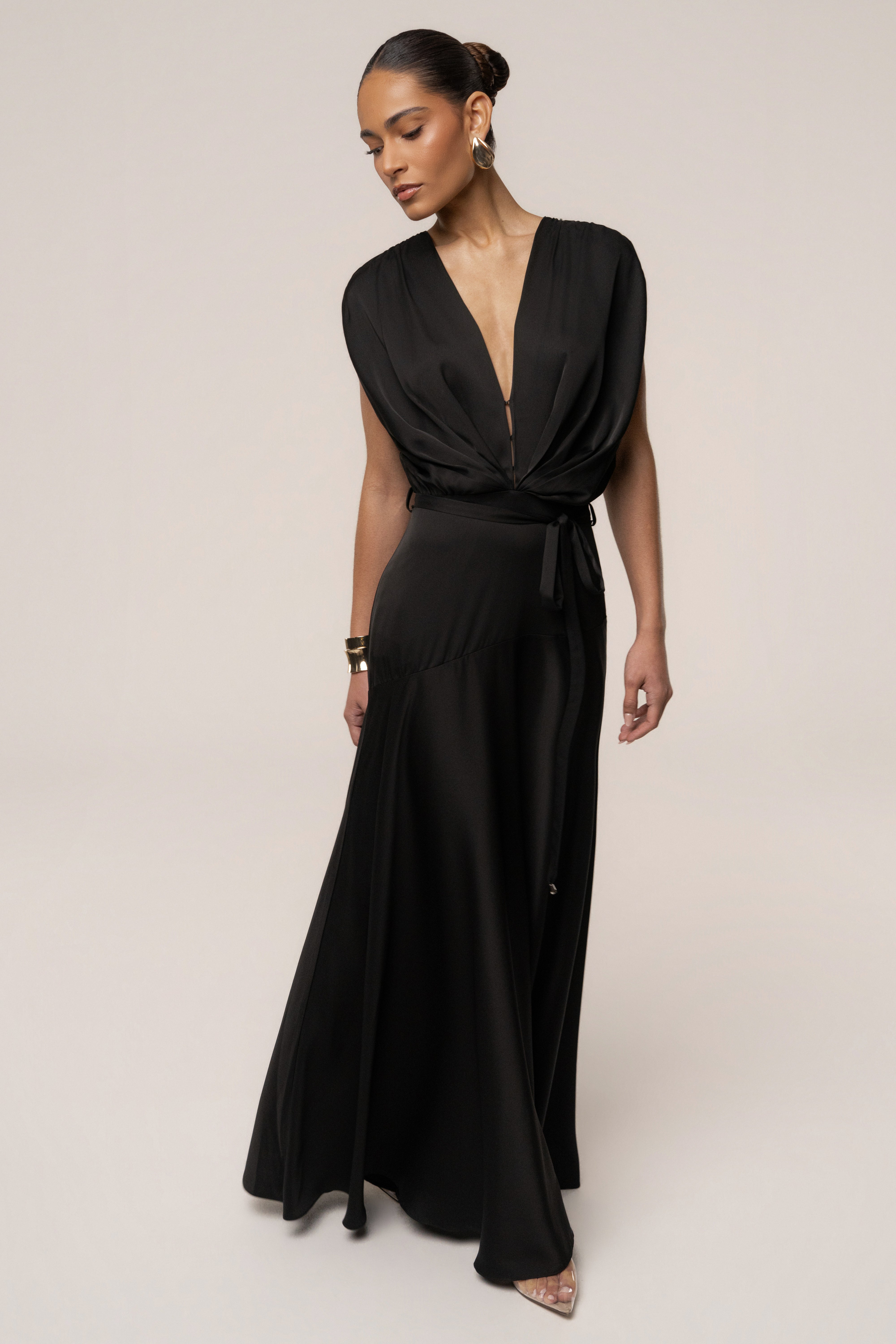 Black Amalia satin maxi dress by JLUXLABEL, featuring a flowing silhouette and elegant design, displayed on a model.