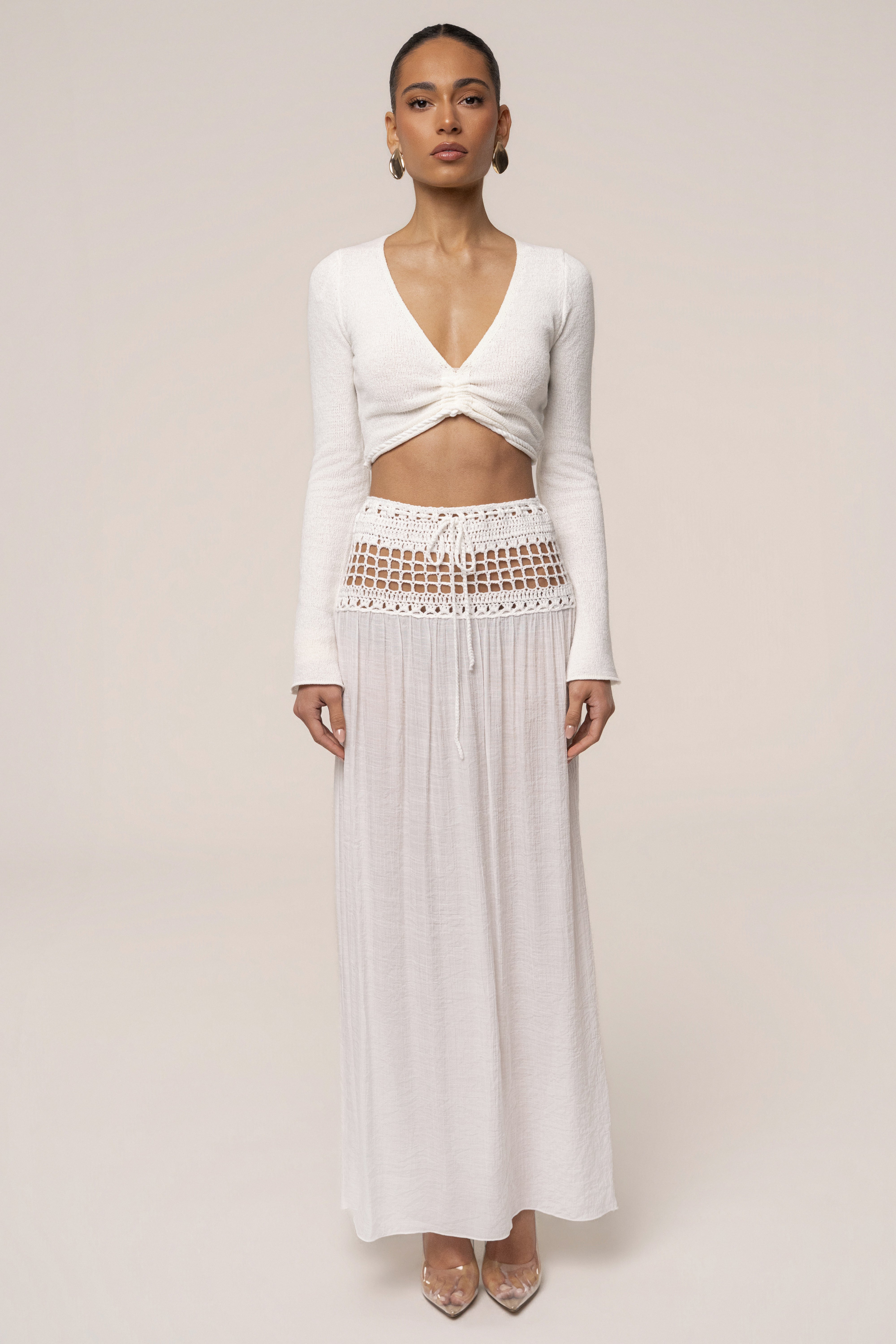 Ivory crochet maxi skirt by JLUXLABEL, flowing resort style bottoms with intricate crochet details and a relaxed fit.