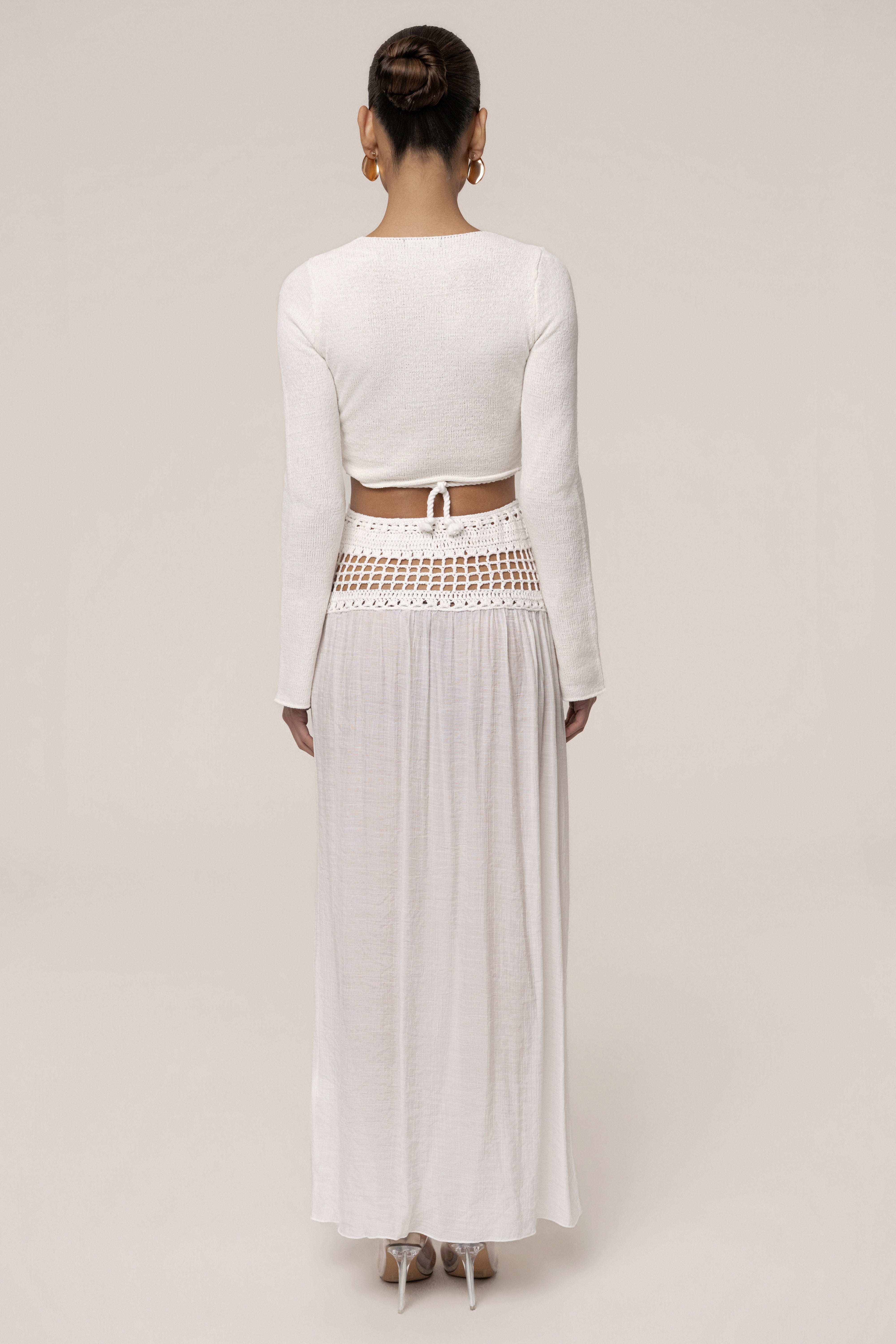 Ivory crochet maxi skirt from JLUXLABEL featuring a flowy resort-style design and intricate crochet detailing.