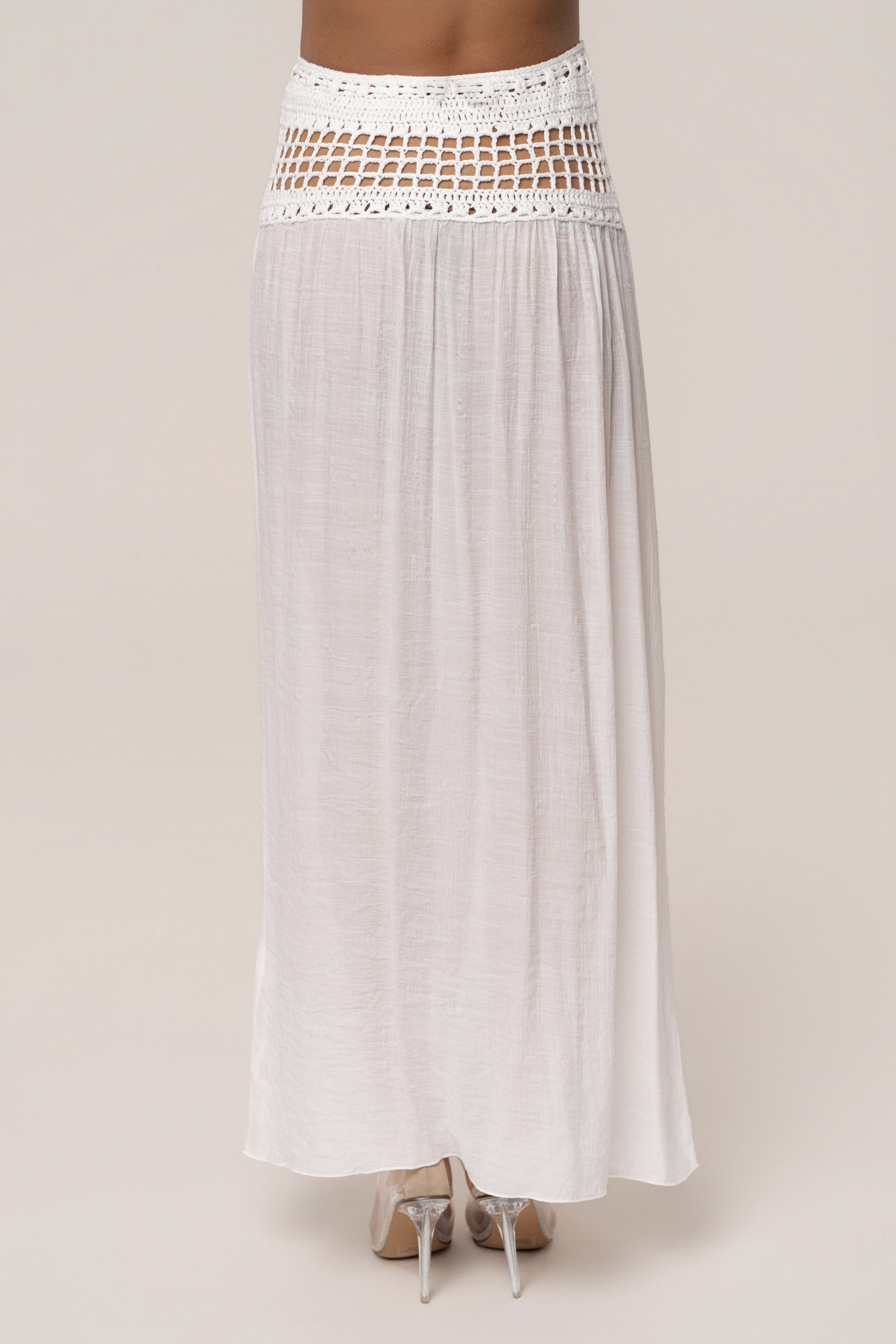 Ivory crochet maxi skirt from JLUXLABEL featuring a flowy resort-style design and intricate crochet details.